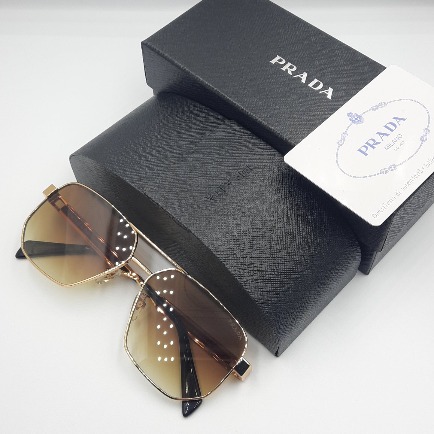 Solaires: PRADA OPS51ZS rouge doré marron deg