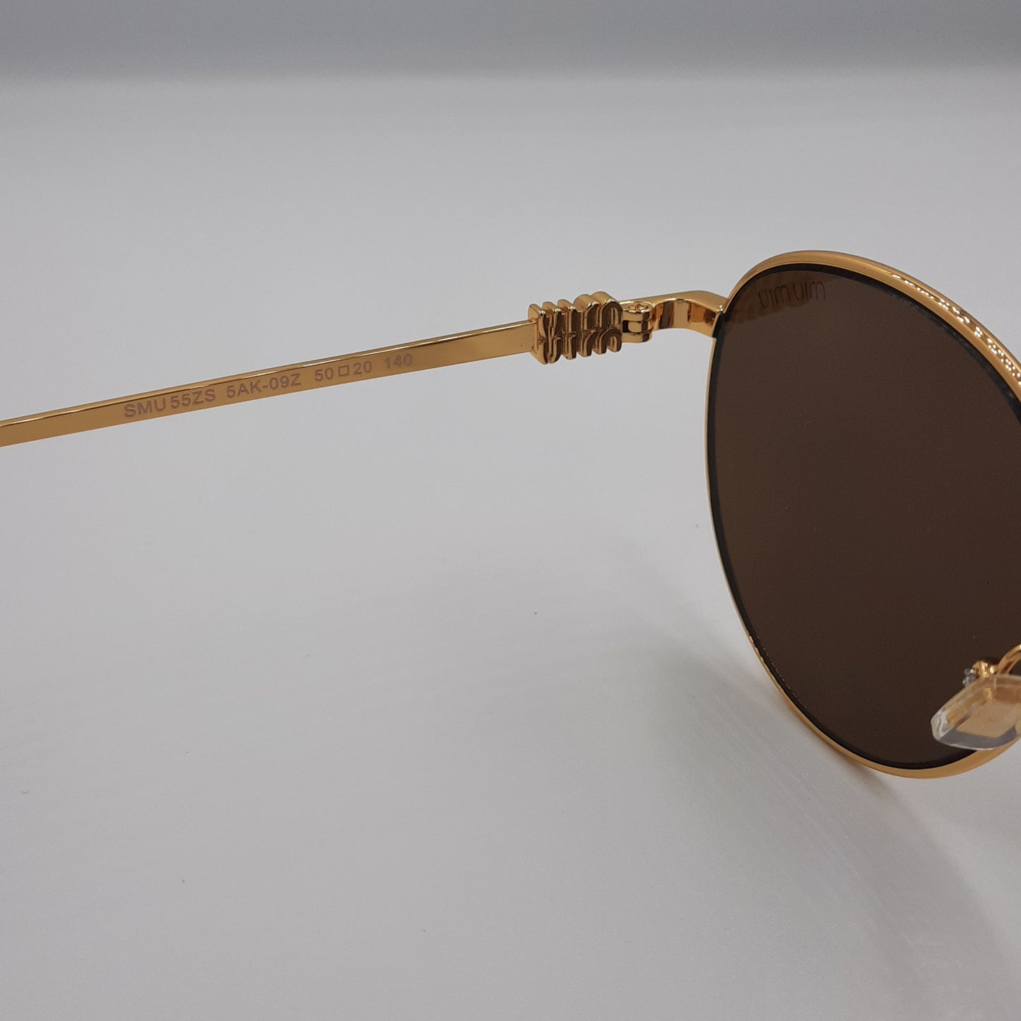 Solaires: MIUMIU SMU55ZS doré marron