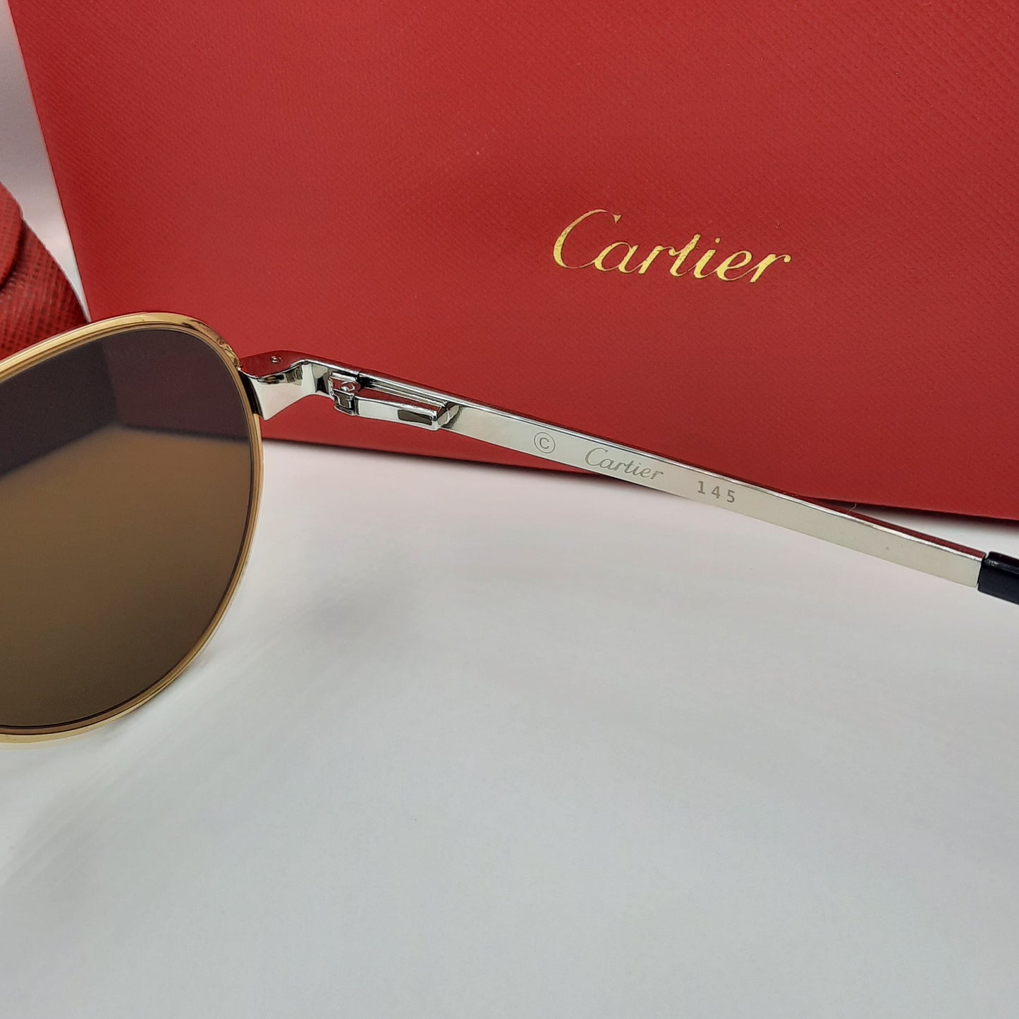 Solaires: CARTIER SANTOS CT0533S argenté doré marron