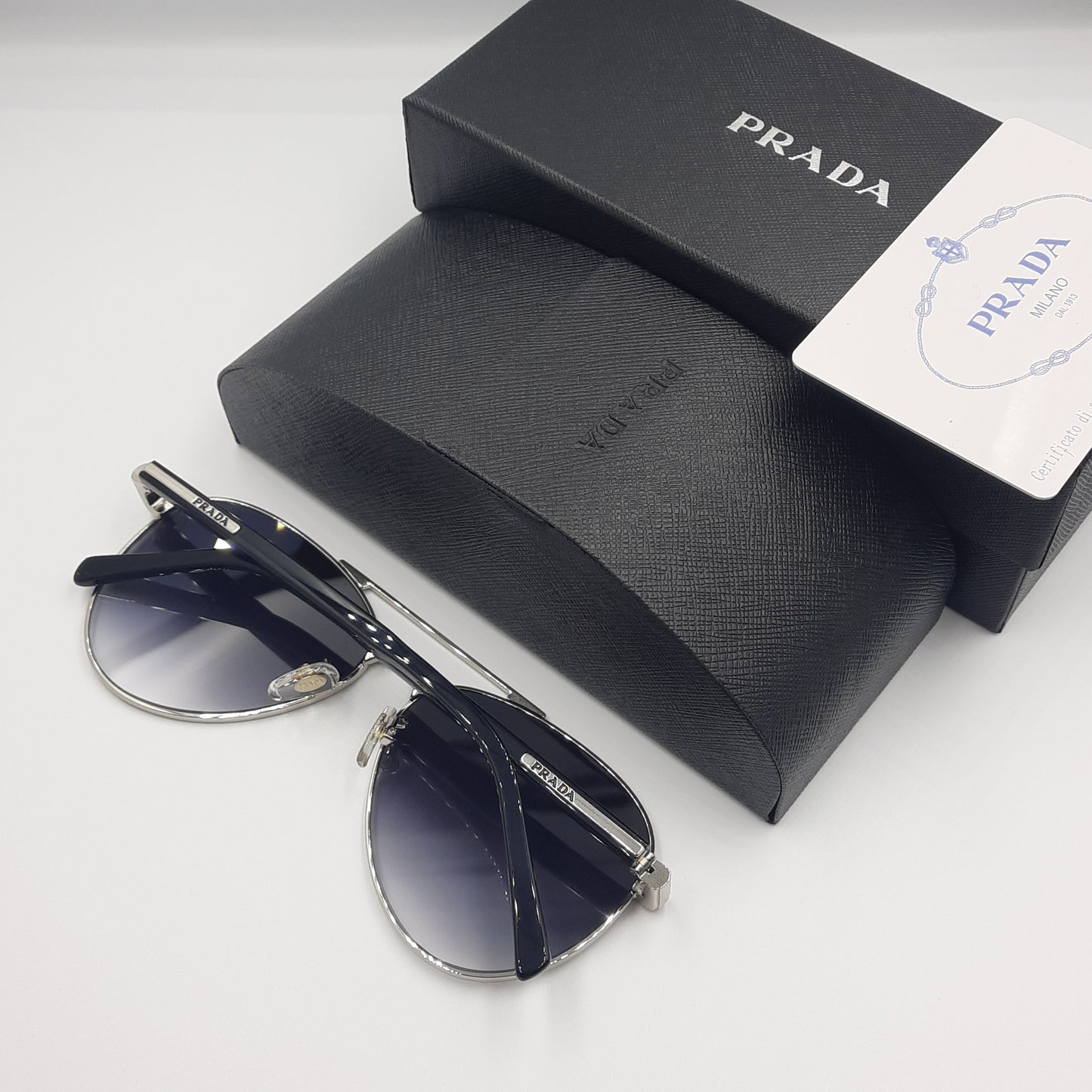 Solaires: PRADA SPRA58 argent noir deg