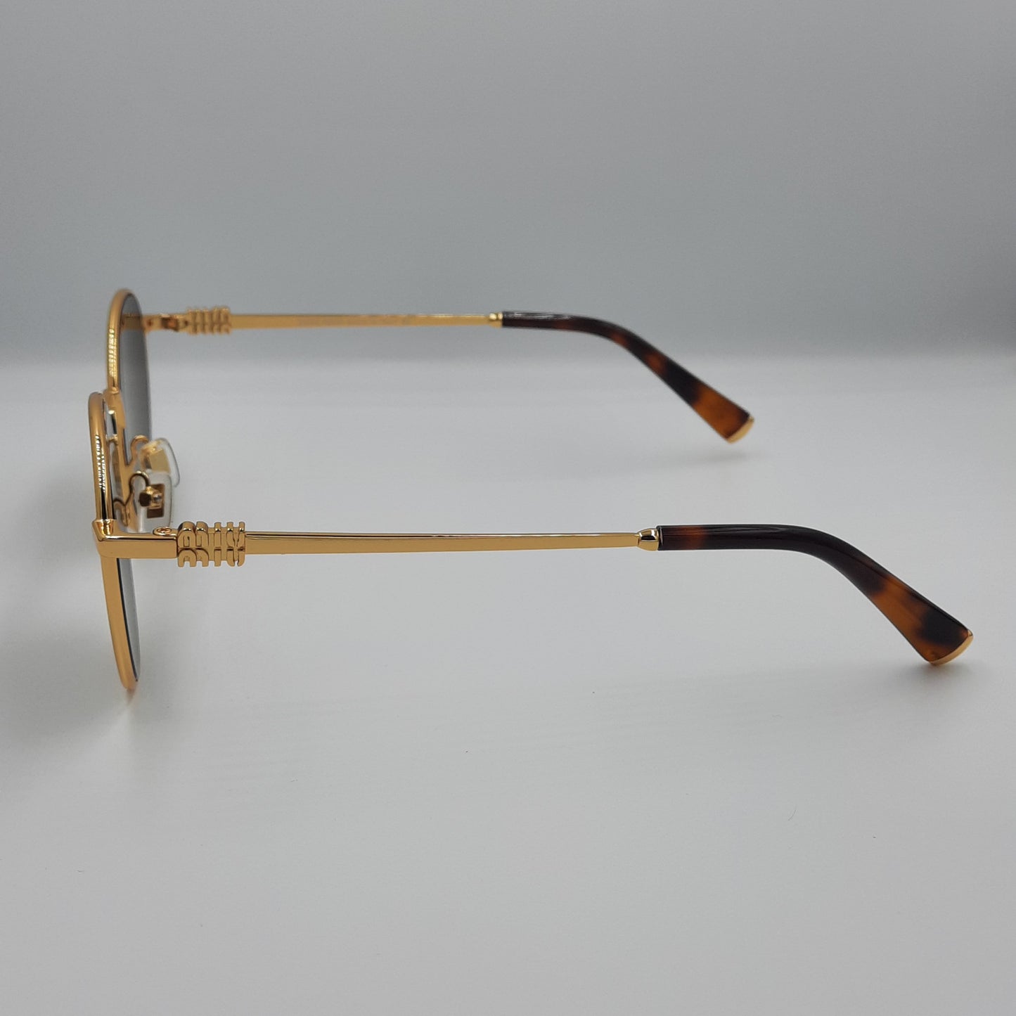 Solaires: MIUMIU SMU55ZS doré marron