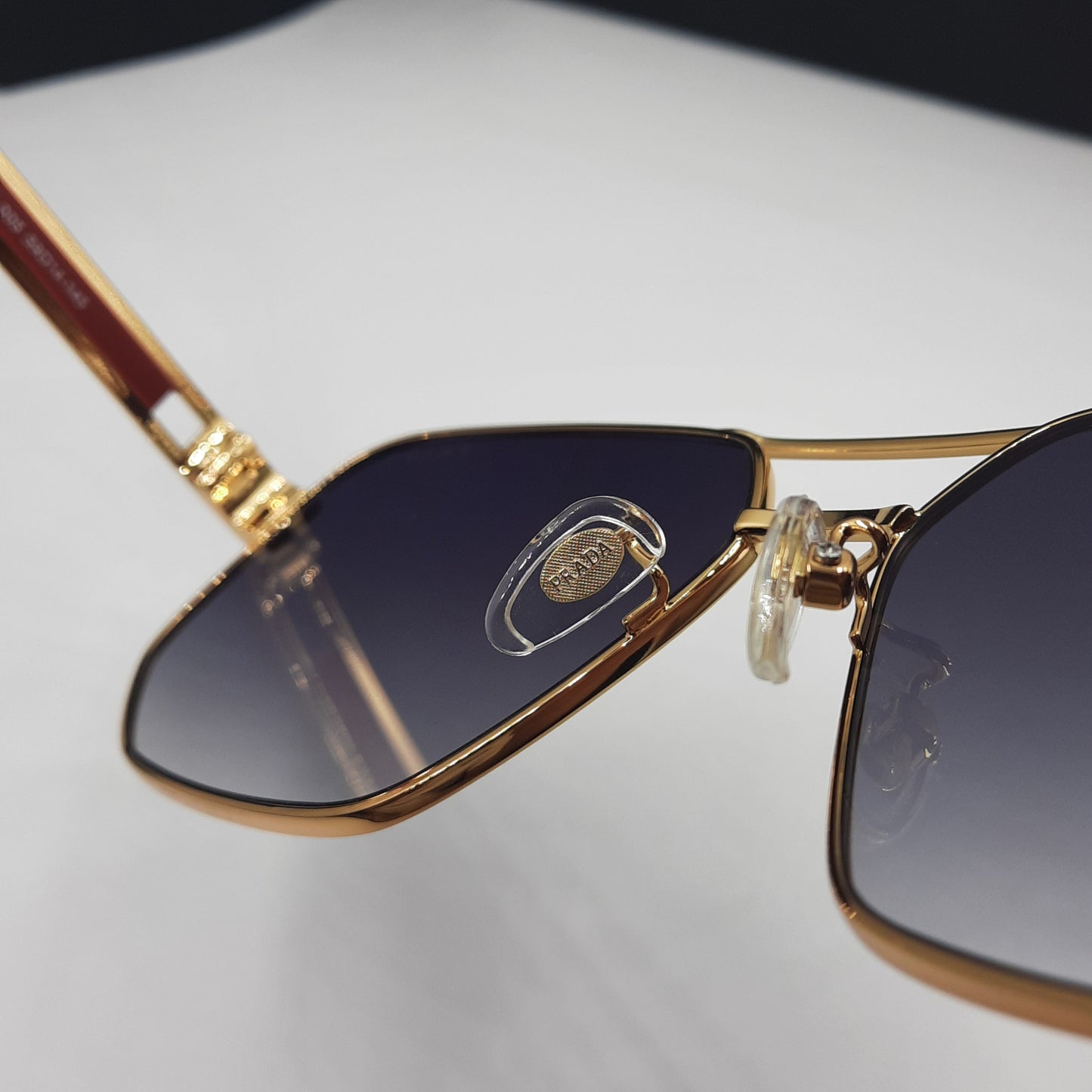 Solaires: PRADA OPS51ZS rouge doré noir