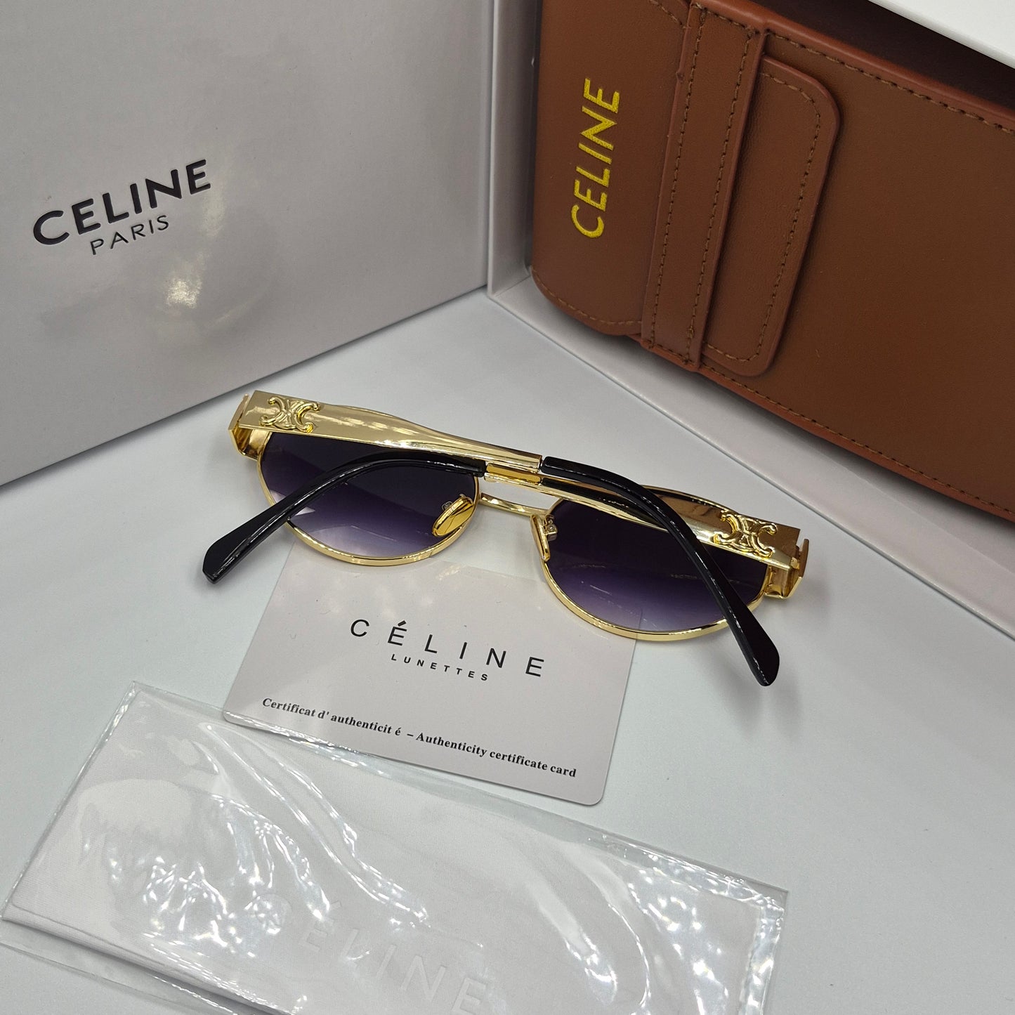 Solaires: CELINE Triomphe doré noir deg avec pochette à bandoulière
