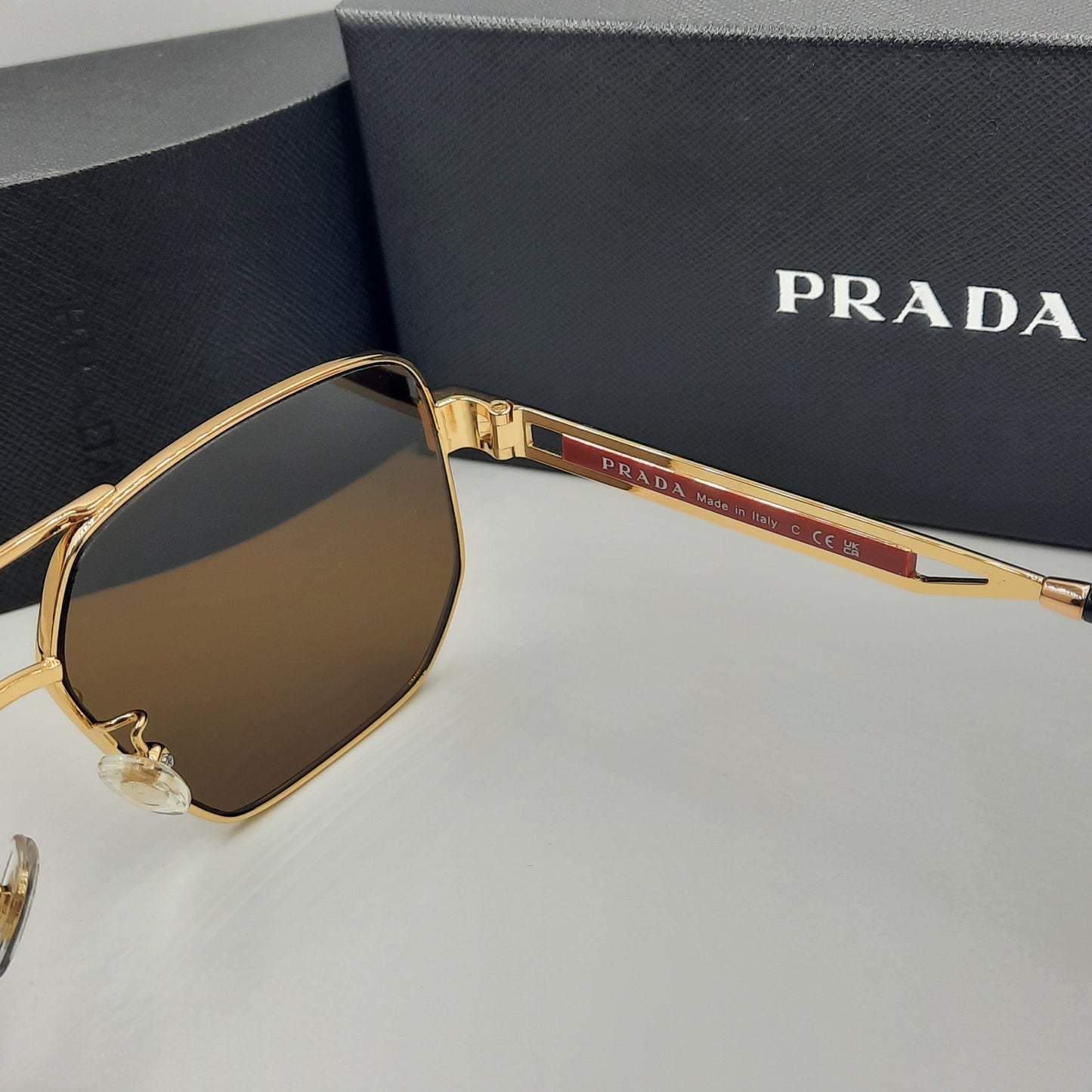 Solaires: PRADA OPS51ZS rouge doré marron