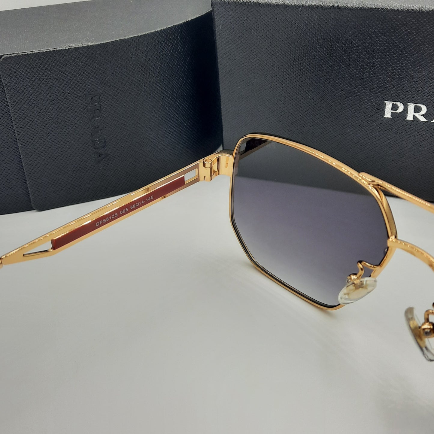 Solaires: PRADA OPS51ZS rouge doré noir