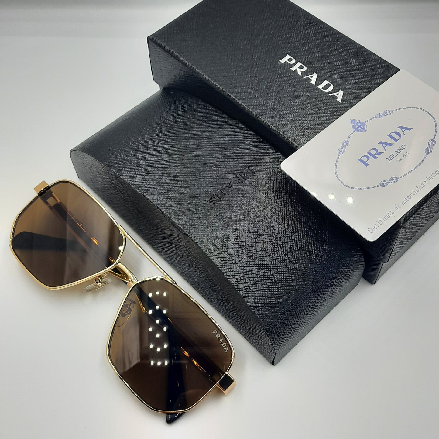 Solaires: PRADA OPS51ZS rouge doré marron