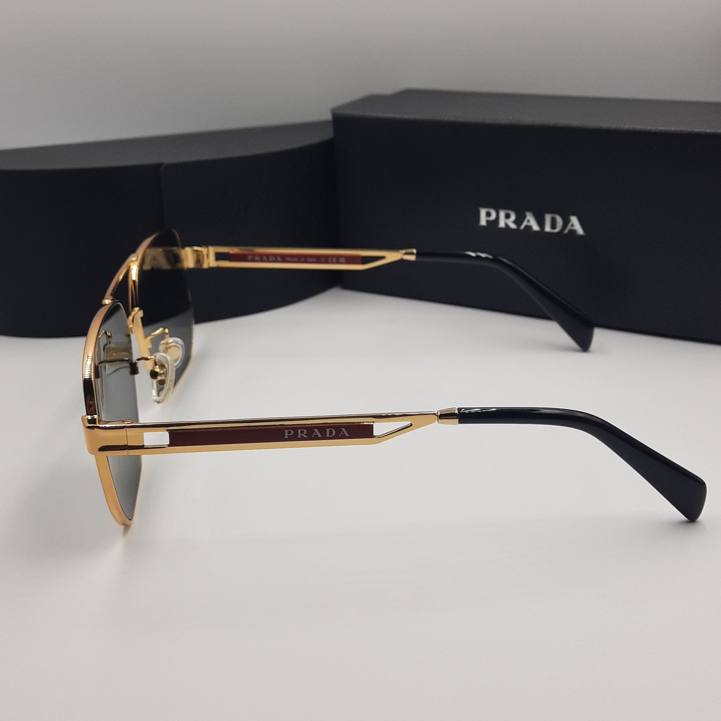 Solaires: PRADA OPS51ZS rouge doré noir
