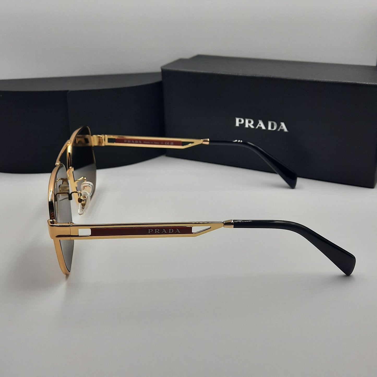 Solaires: PRADA OPS51ZS rouge doré marron