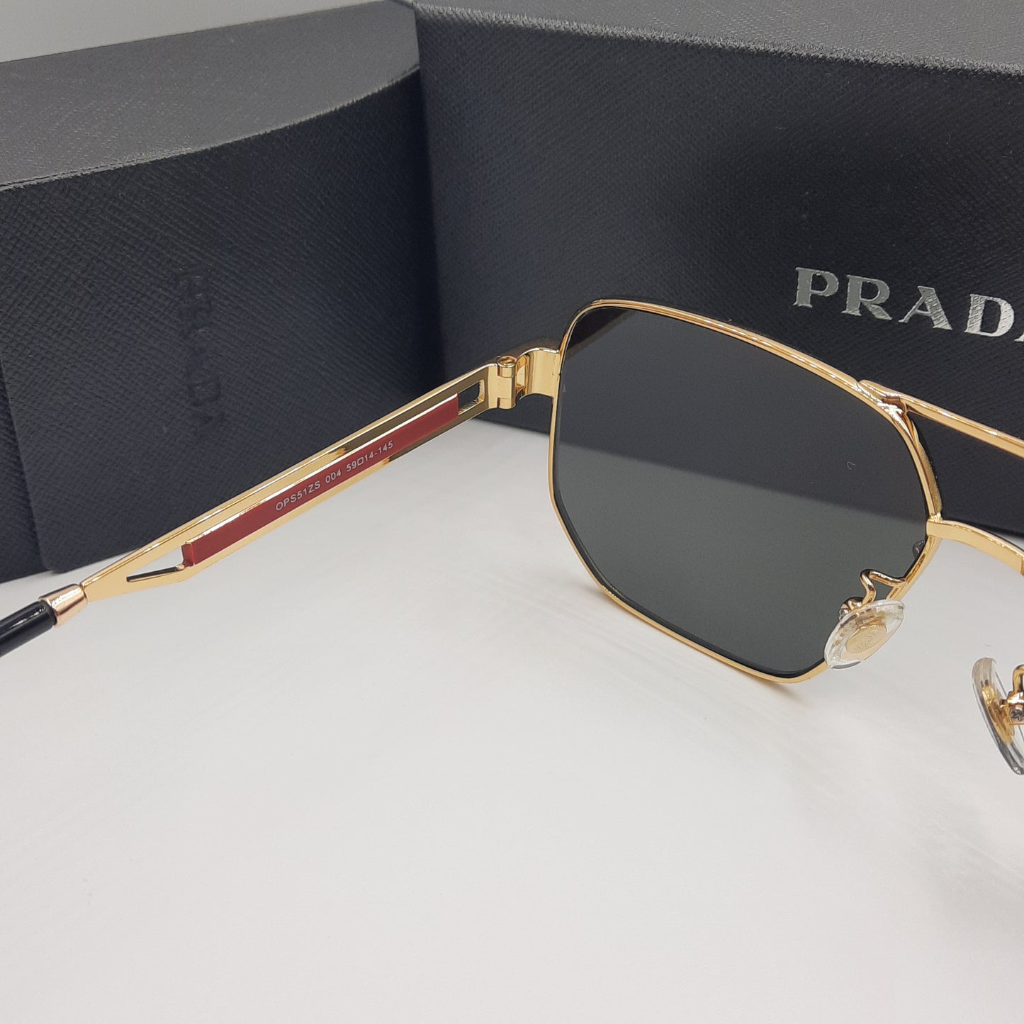 Solaires: PRADA OPS51ZS rouge doré noir