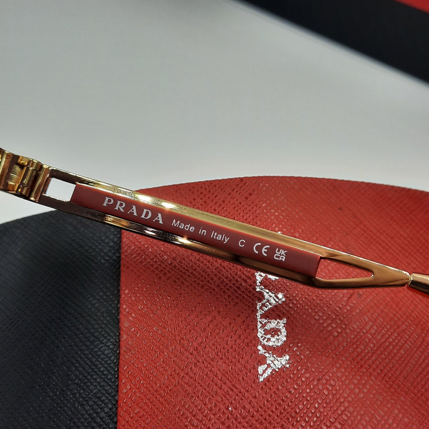 Solaires: PRADA OPS51ZS rouge doré noir