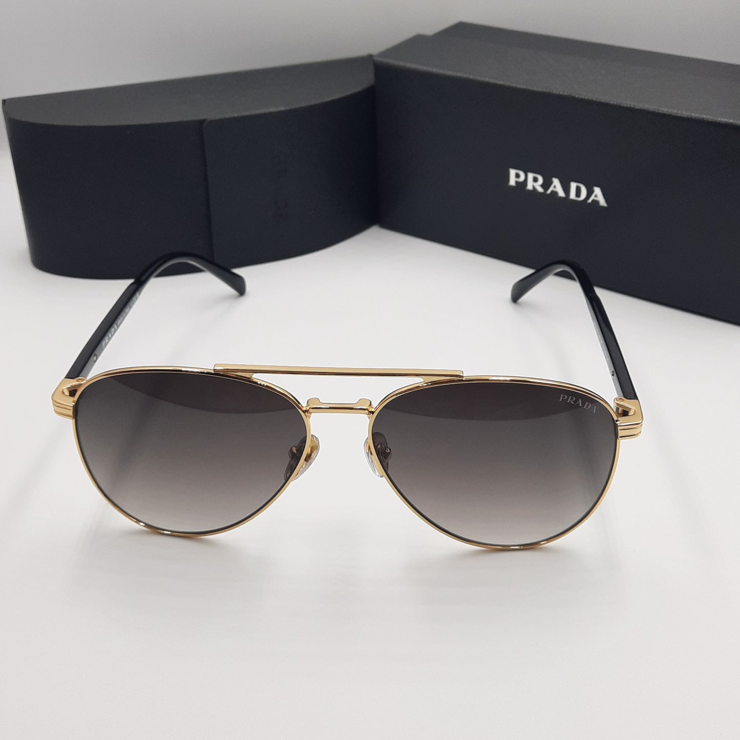 Solaires: PRADA SPRA58 rouge doré noir