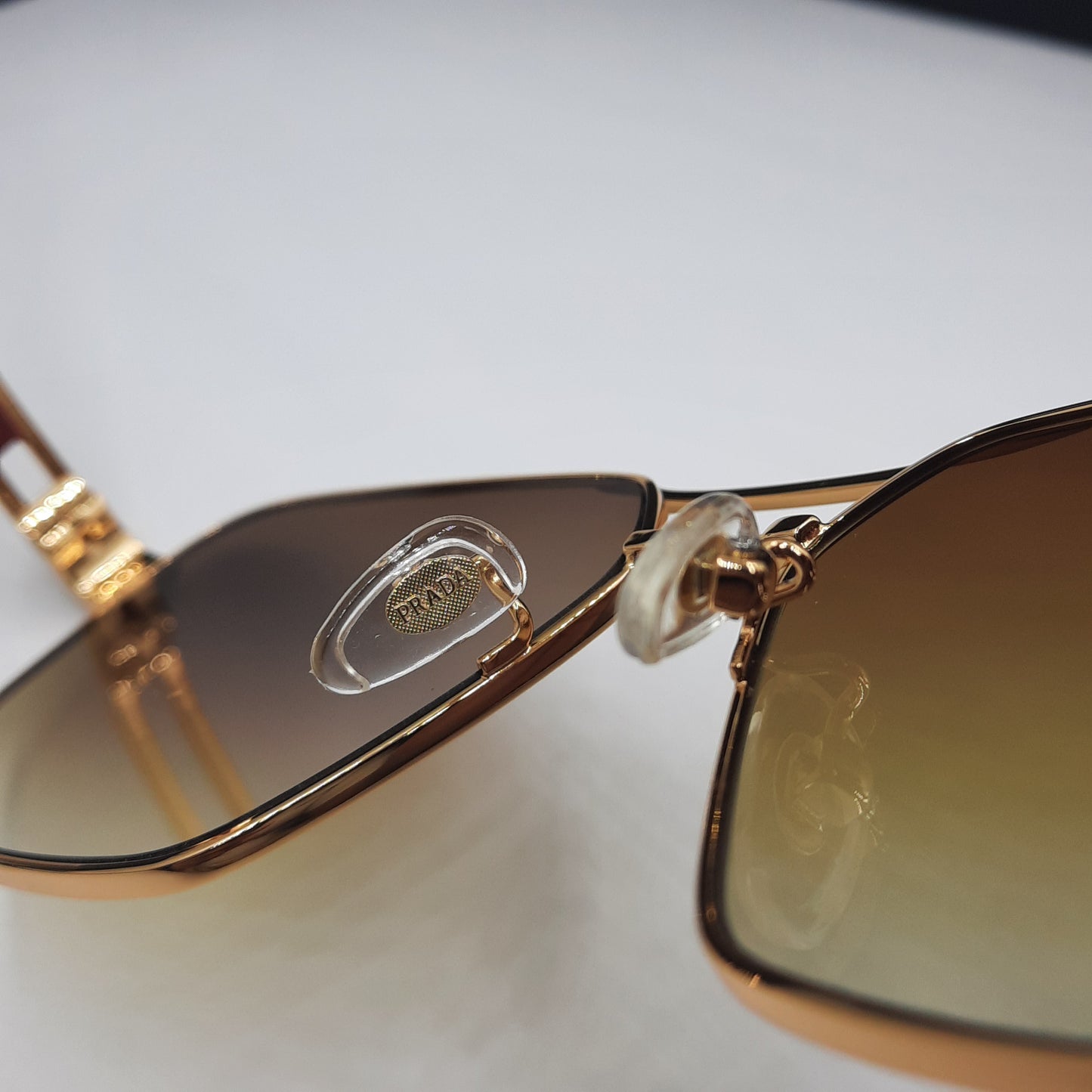 Solaires: PRADA OPS51ZS rouge doré marron deg
