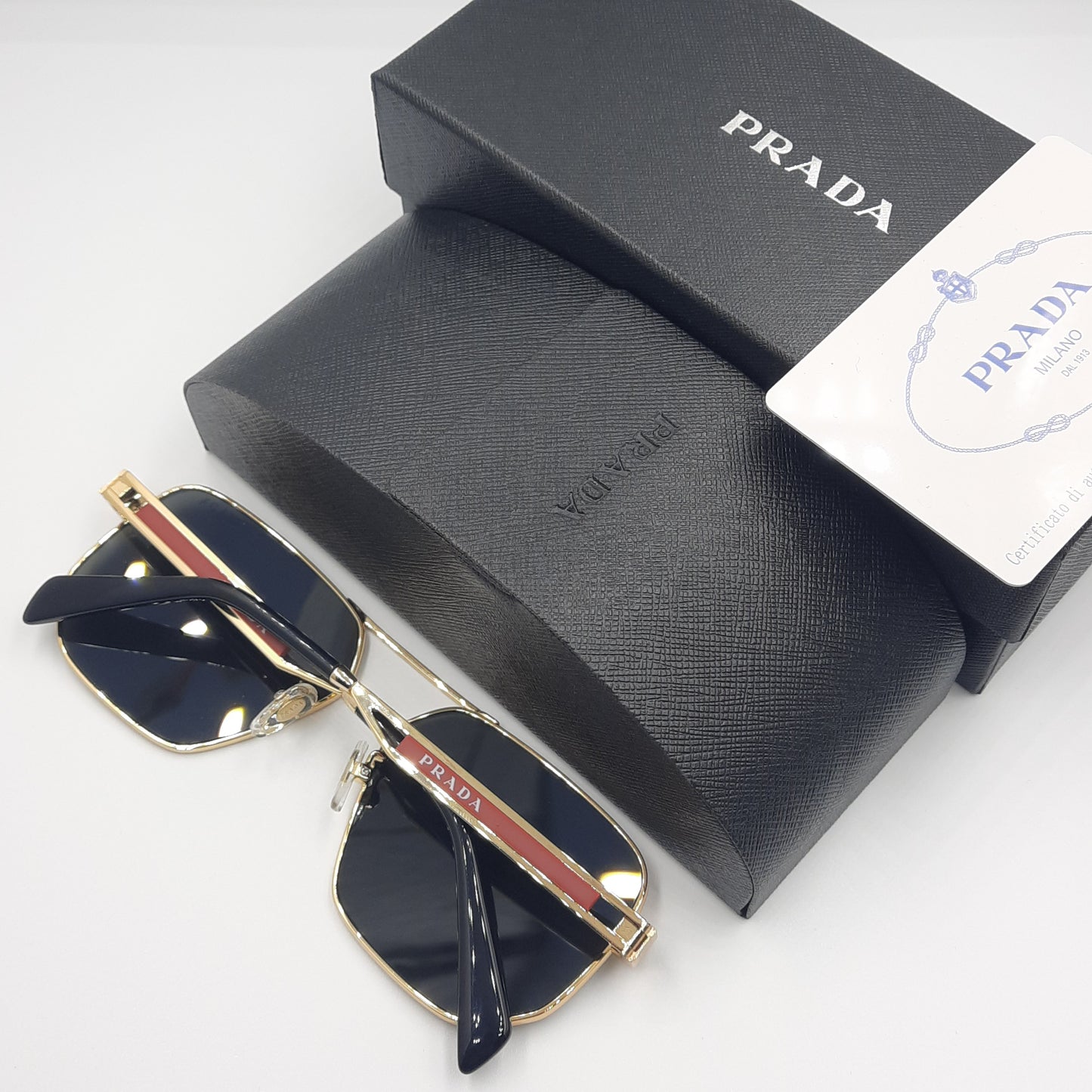 Solaires: PRADA OPS51ZS rouge doré noir
