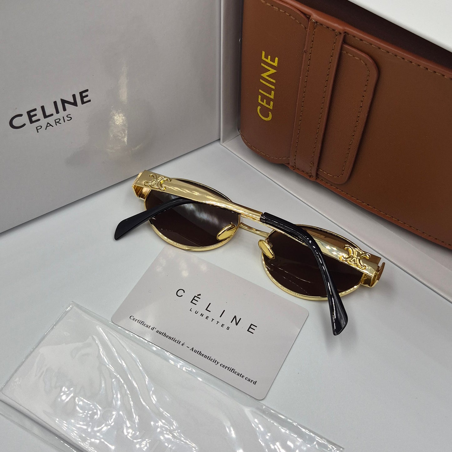 Solaires: CELINE Triomphe doré marron avec pochette à bandoulière