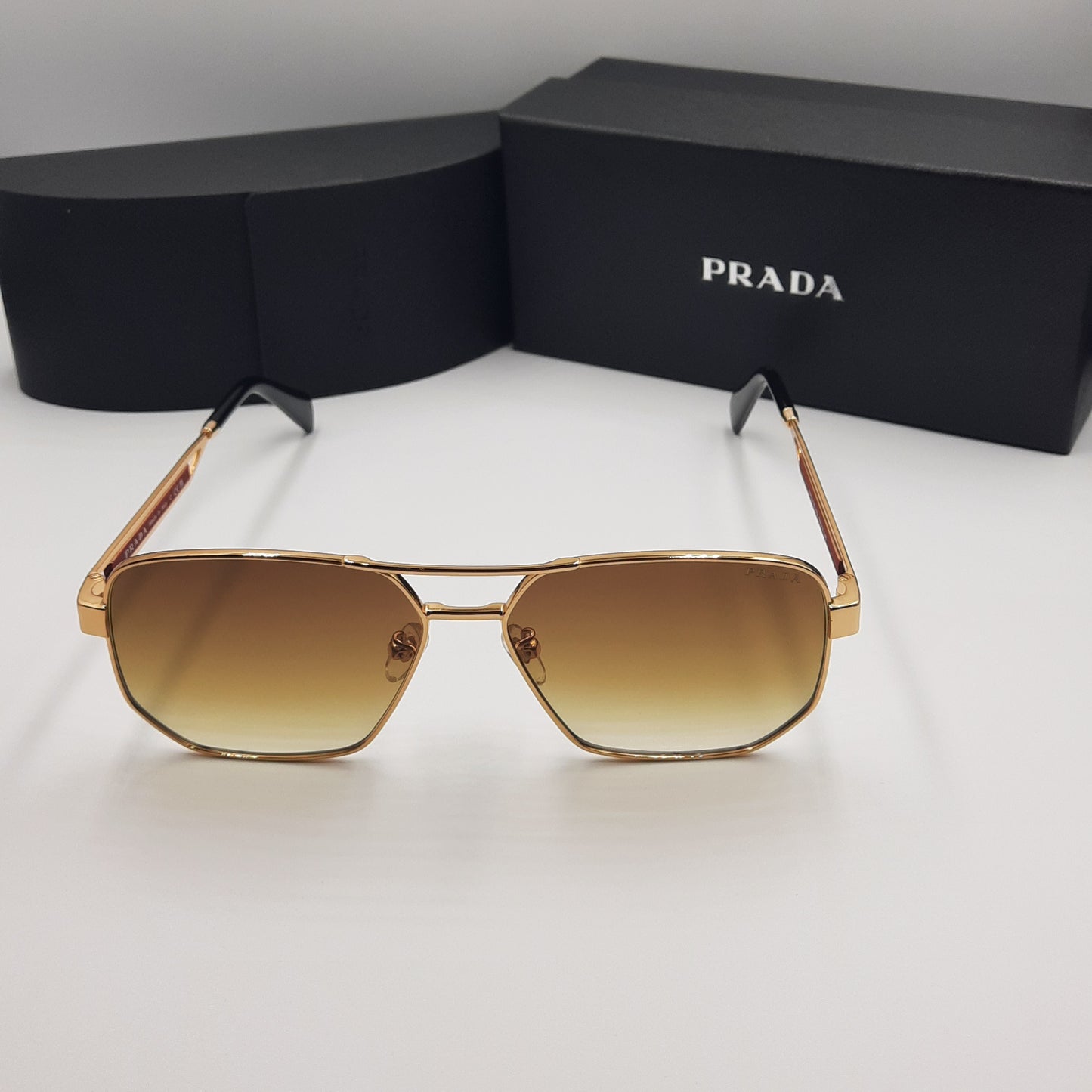 Solaires: PRADA OPS51ZS rouge doré marron deg