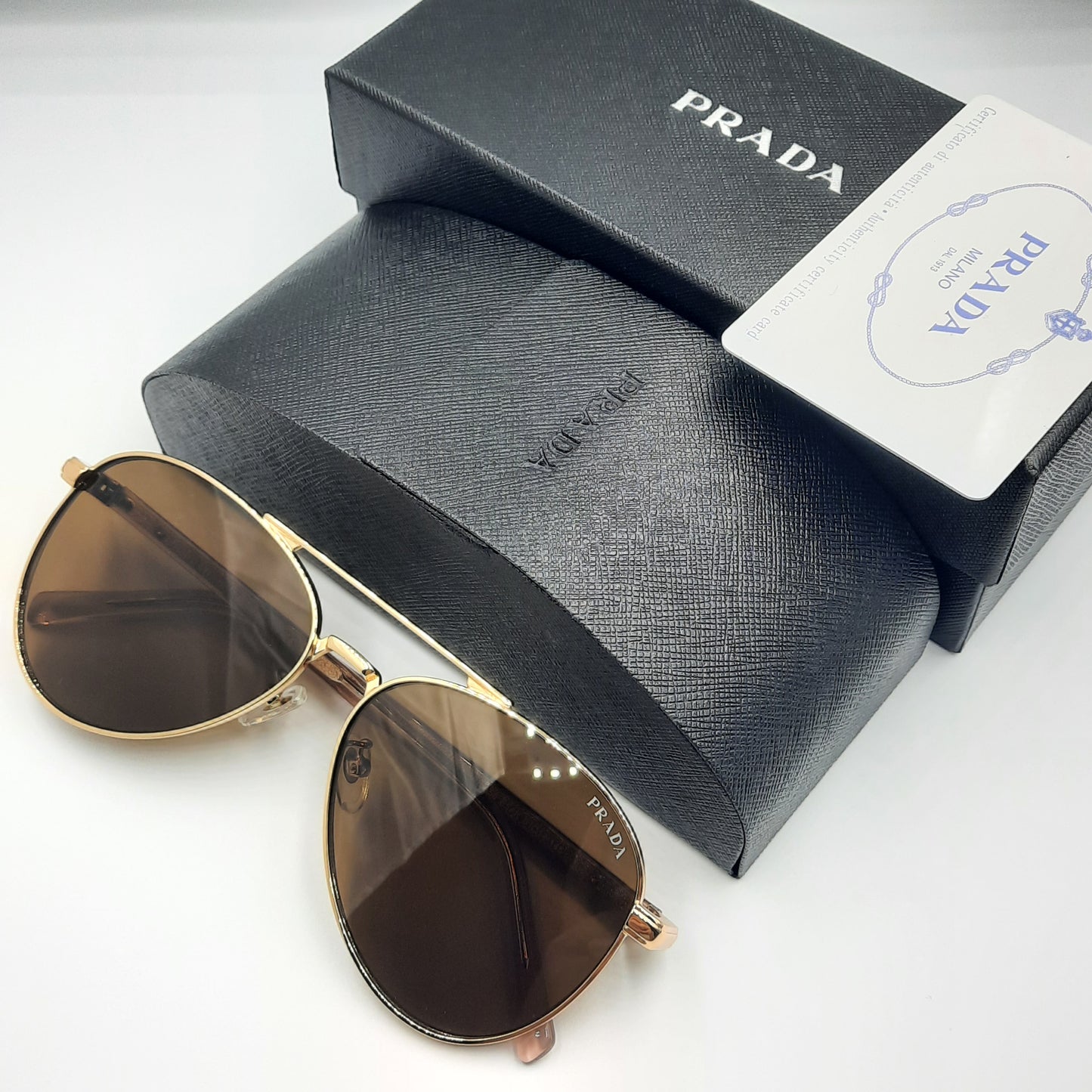Solaires: PRADA SPRA58 rose gold