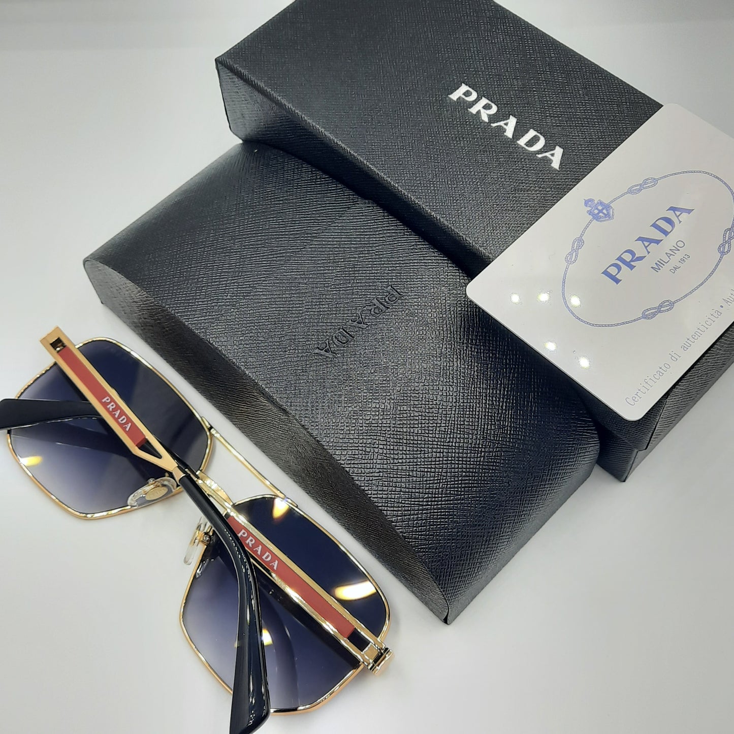 Solaires: PRADA OPS51ZS rouge doré noir