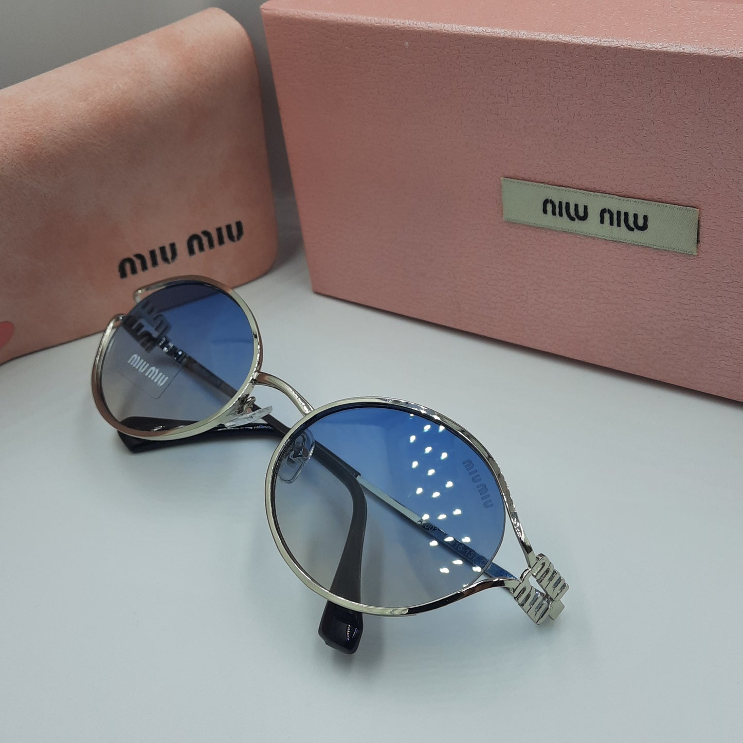 Solaires: MIUMIU argenté bleu