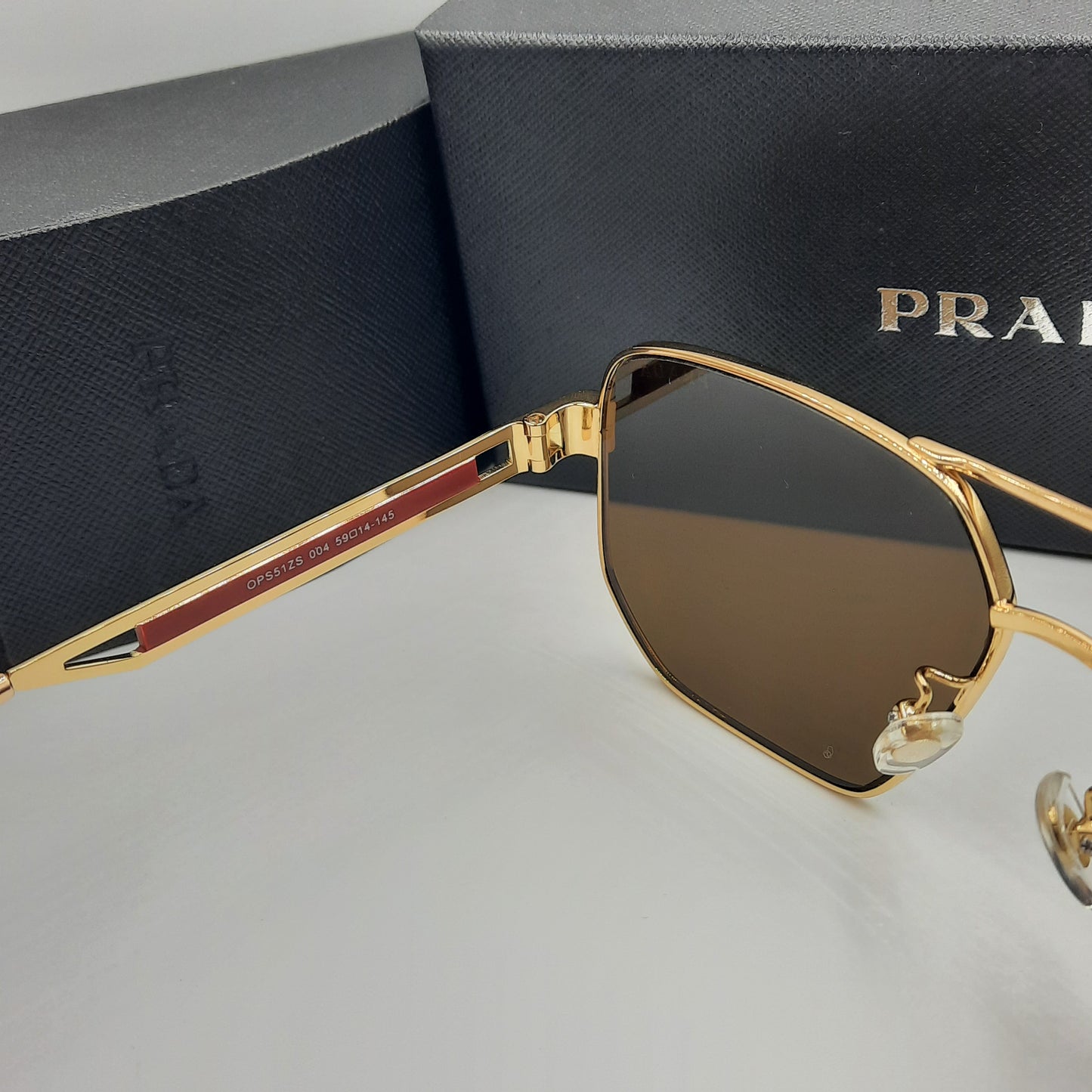 Solaires: PRADA OPS51ZS rouge doré marron