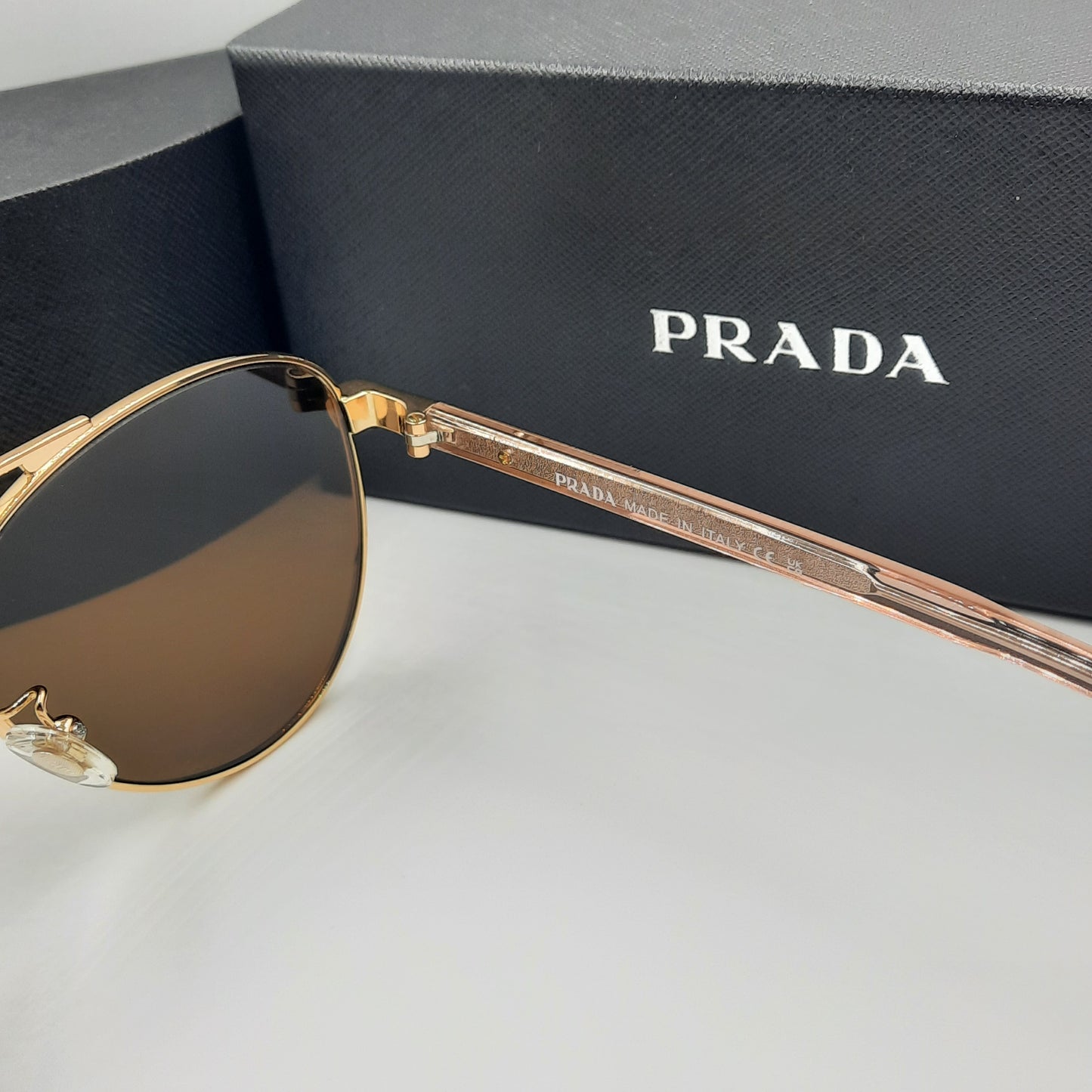 Solaires: PRADA SPRA58 rose gold