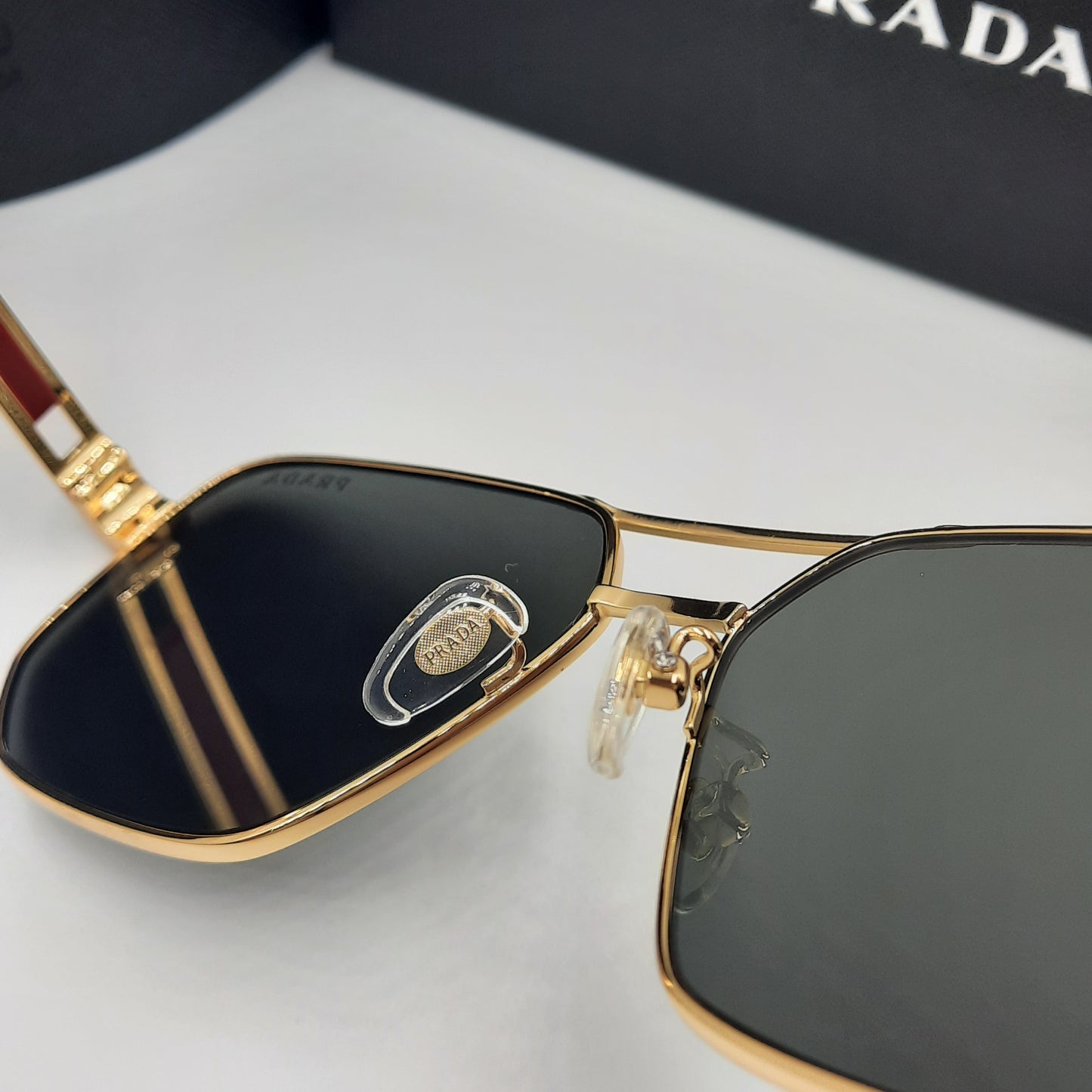 Solaires: PRADA OPS51ZS rouge doré noir