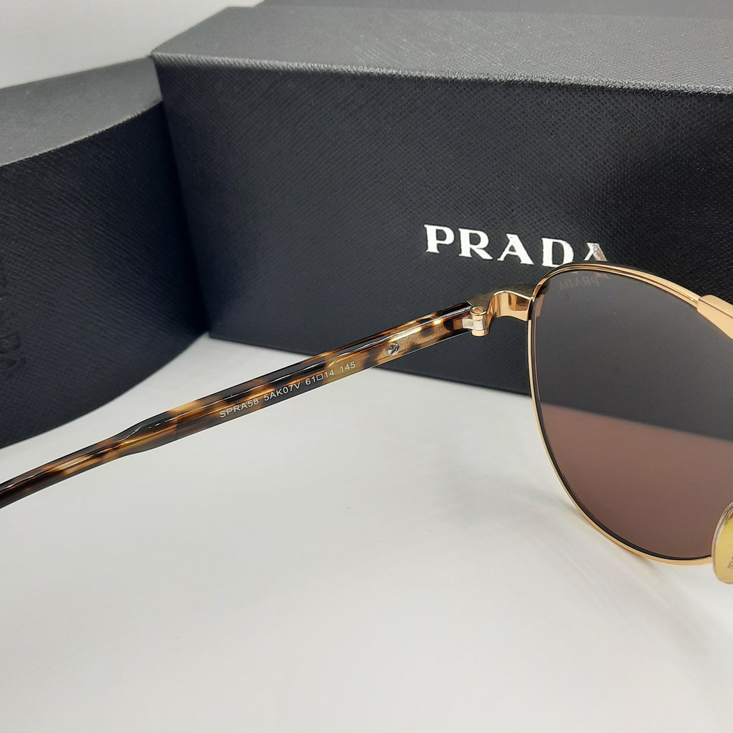 Solaires: PRADA SPRA58 doré marron havane