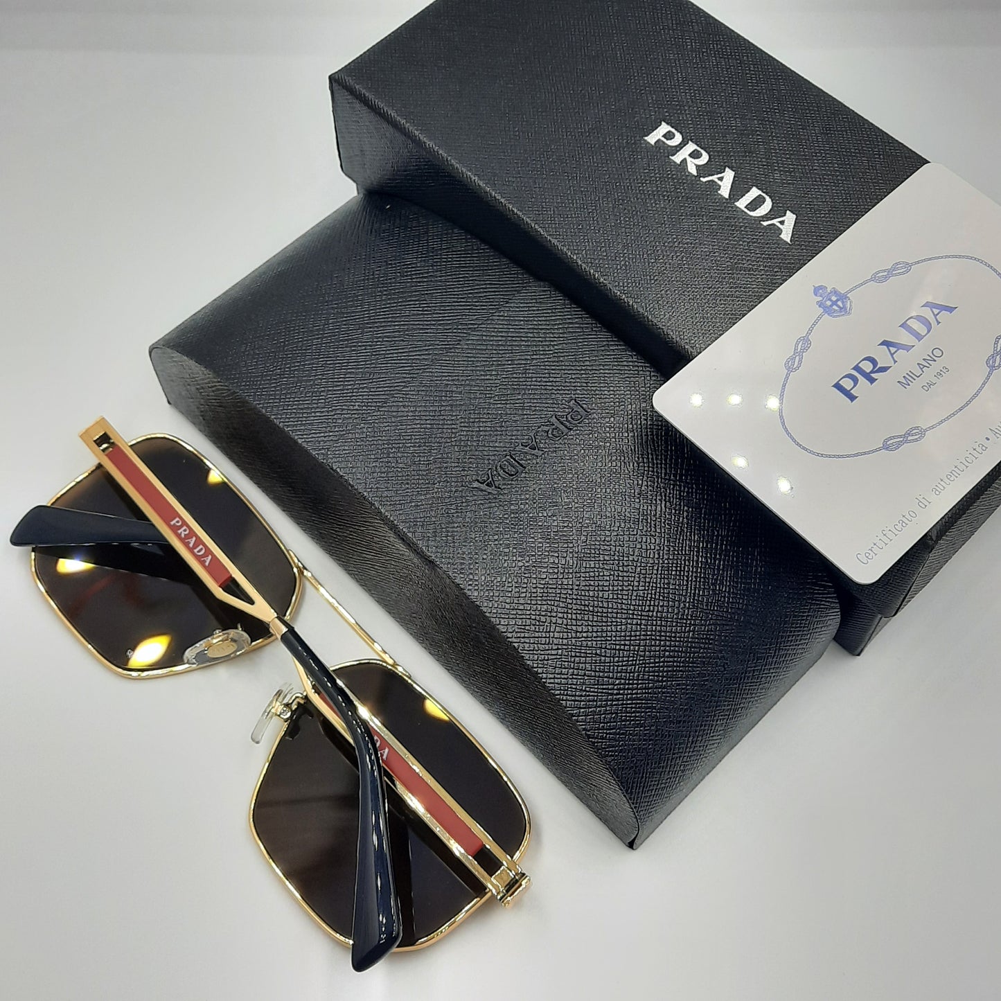 Solaires: PRADA OPS51ZS rouge doré marron