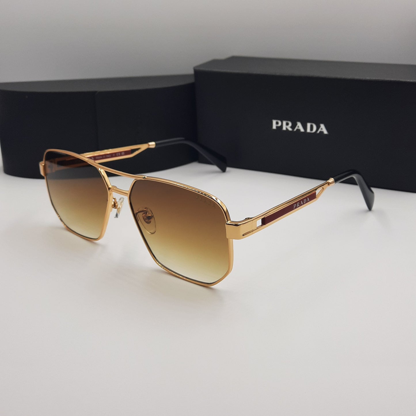 Solaires: PRADA OPS51ZS rouge doré marron deg