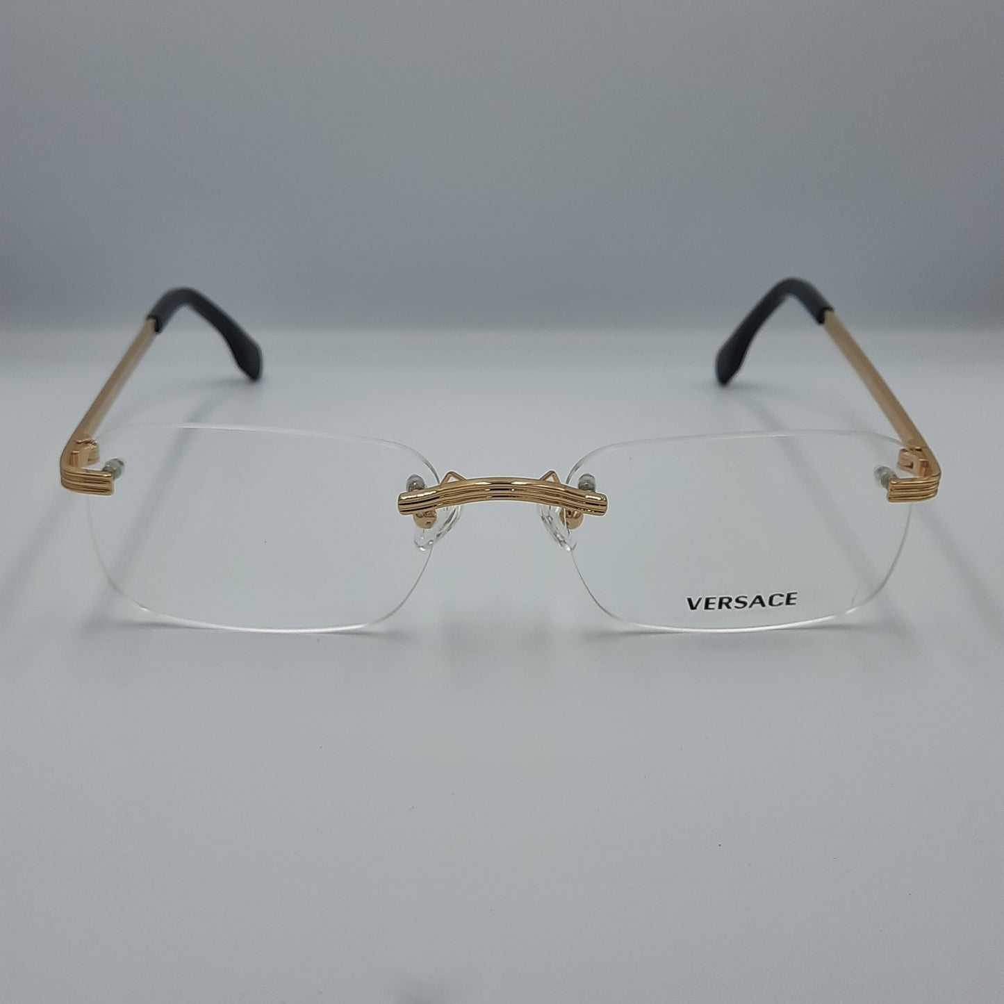 Lunette optique percée Versace: doré noir