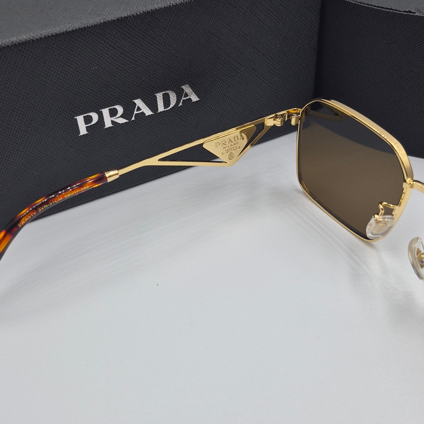 Solaires: PRADA PRA51V doré marron havane