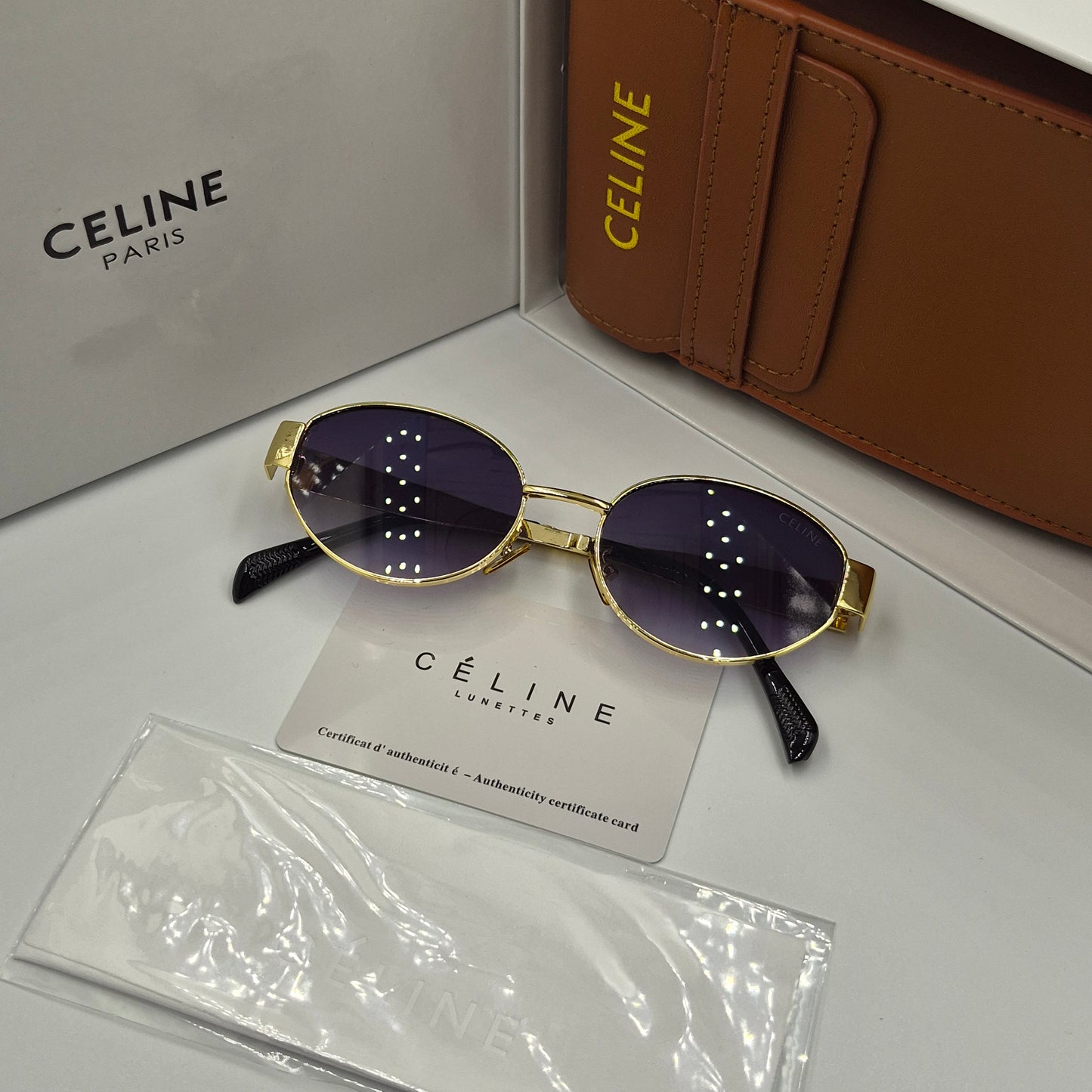 Solaires: CELINE Triomphe doré noir deg avec pochette à bandoulière