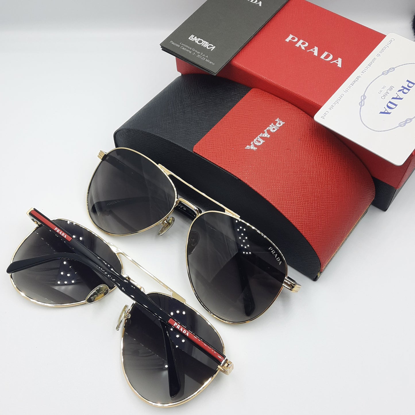 Solaires: PRADA SPRA58 rouge doré noir