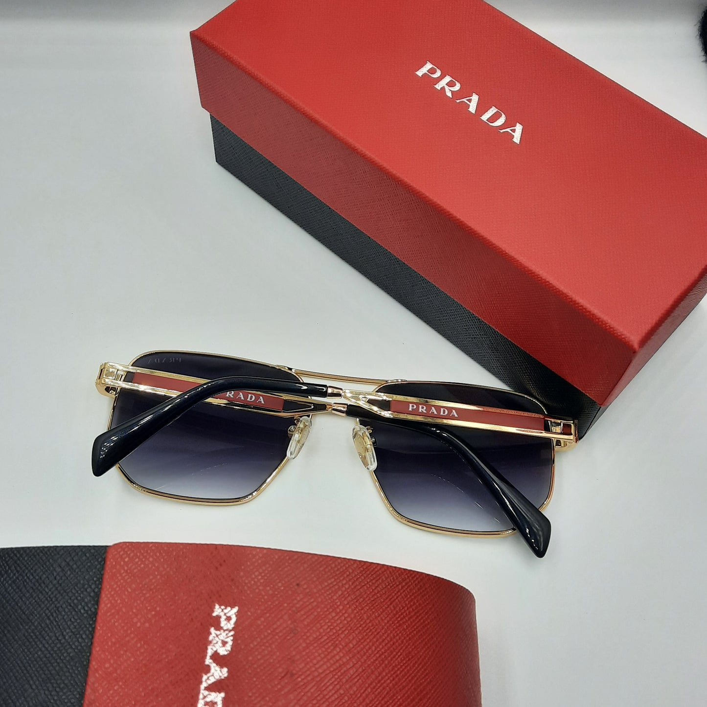 Solaires: PRADA OPS51ZS rouge doré noir