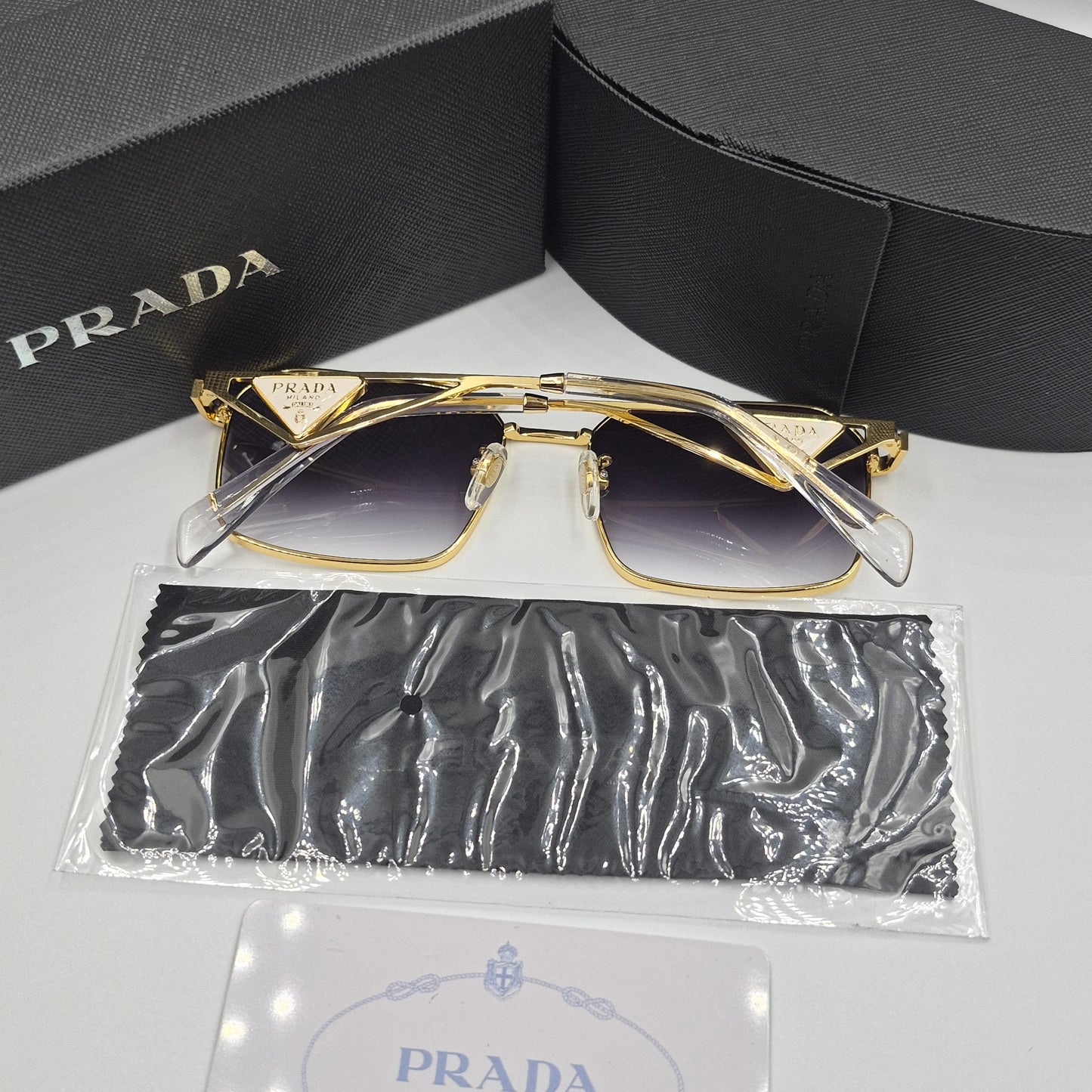 Solaires: PRADA PRA51V doré noir deg