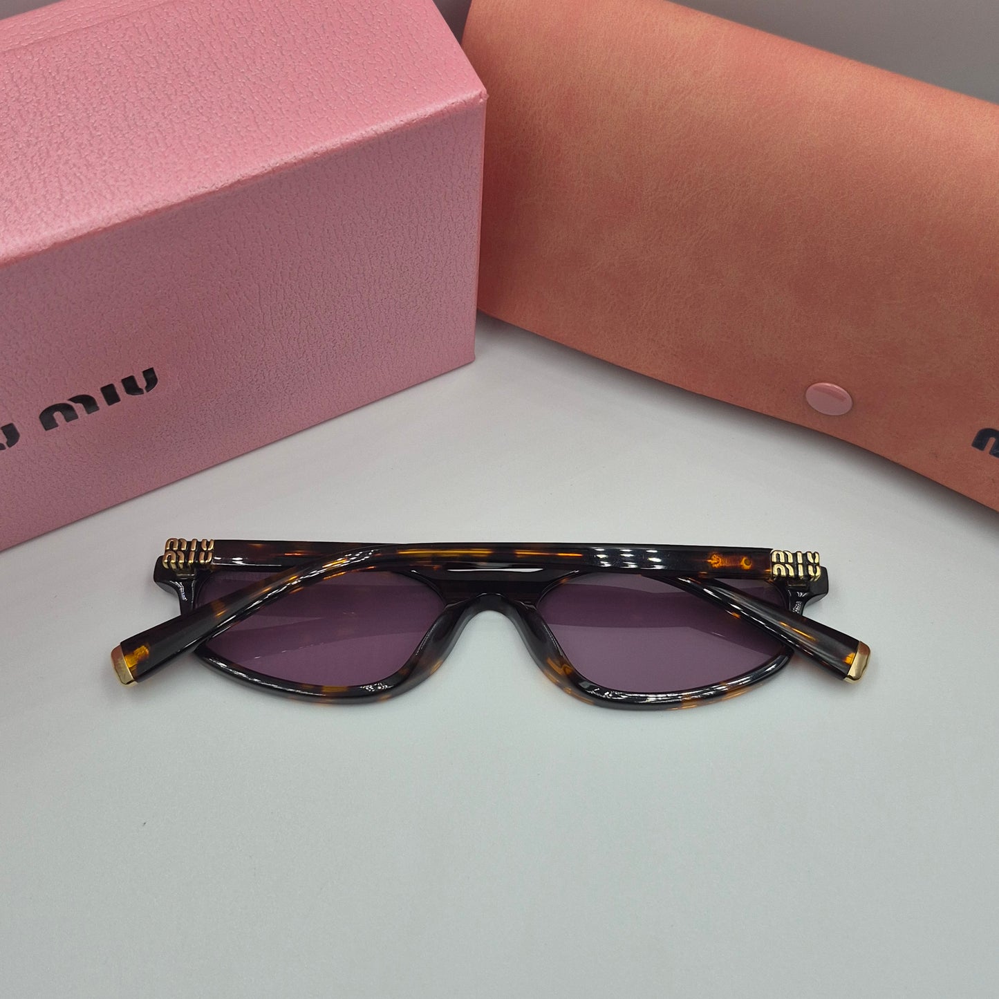 Solaires: MIUMIU SMU06S violet havane