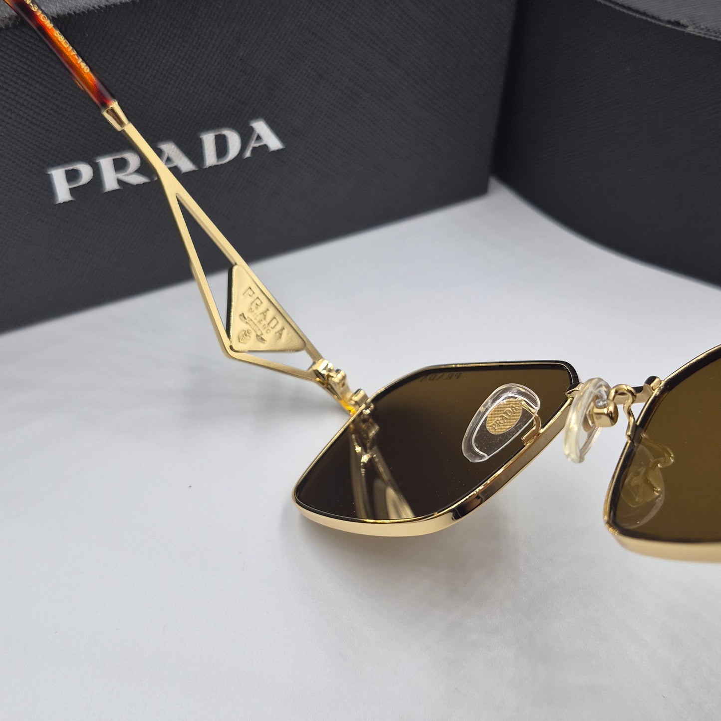 Solaires: PRADA PRA51V doré marron havane