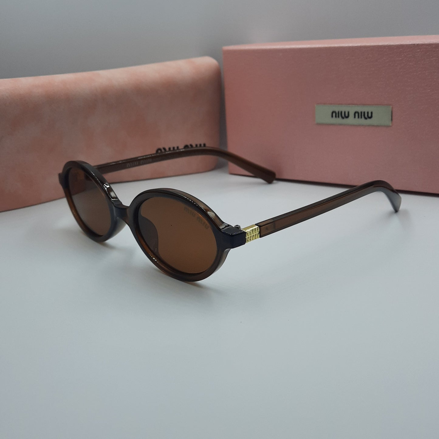 Solaires: MIUMIU doré marron