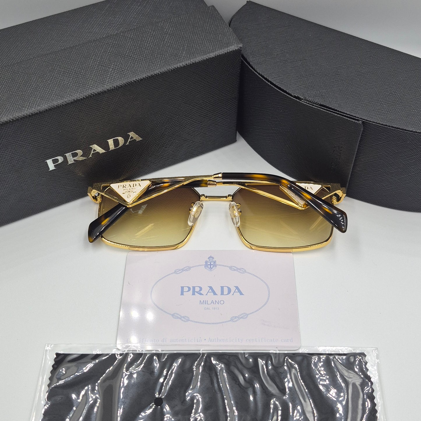 Solaires: PRADA PRA51V doré marron deg