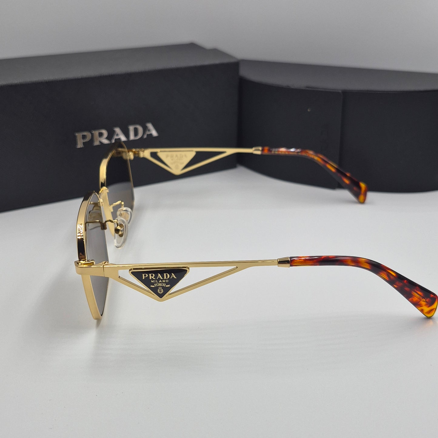 Solaires: PRADA PRA51V doré marron havane