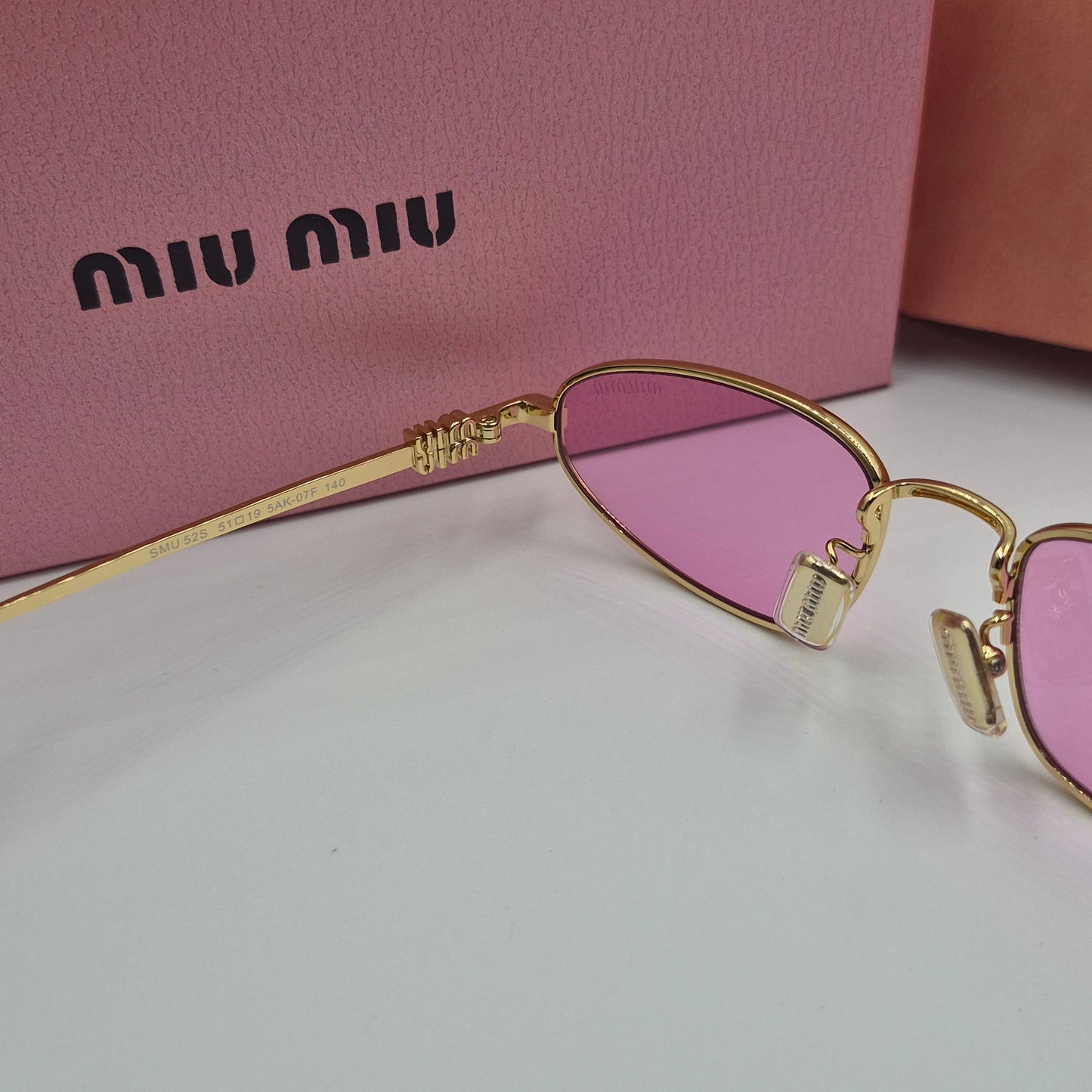 Solaires: MIUMIU SMU52S doré rose