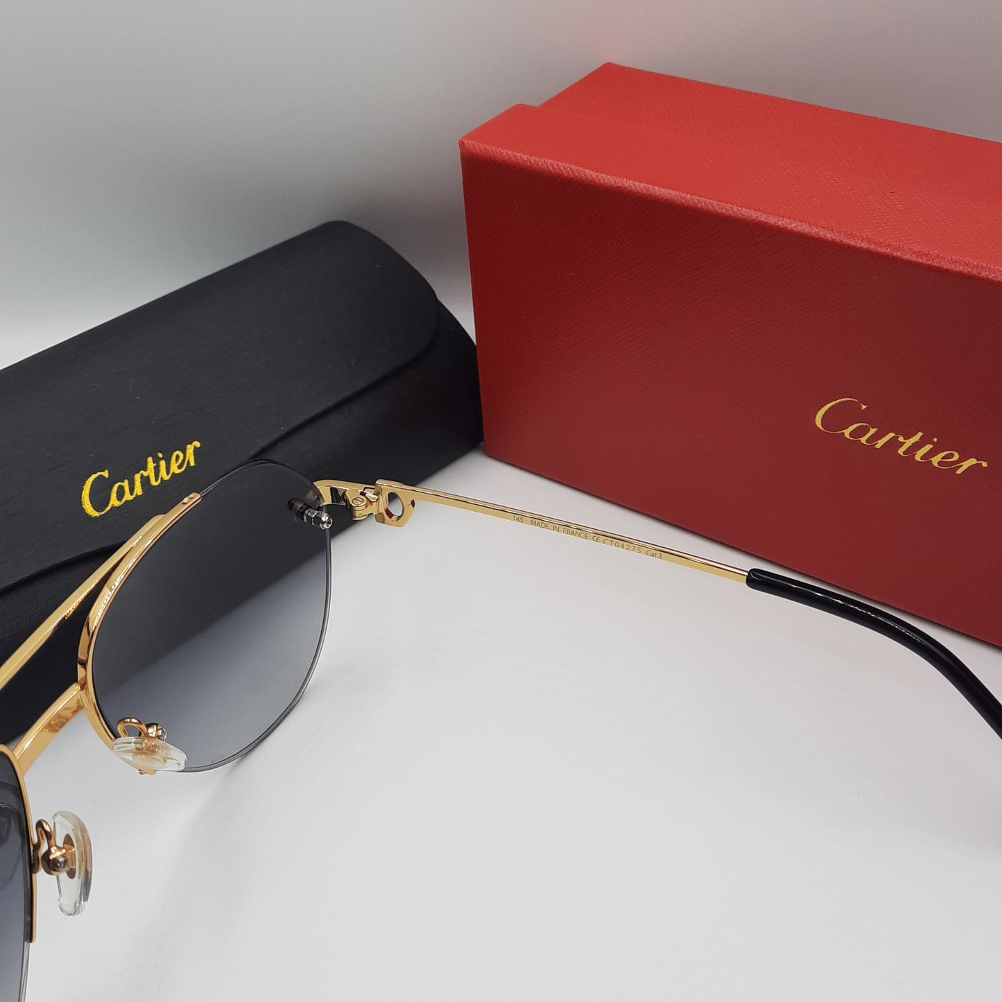 Solaires: CARTIER semi percé CT0427S doré noir
