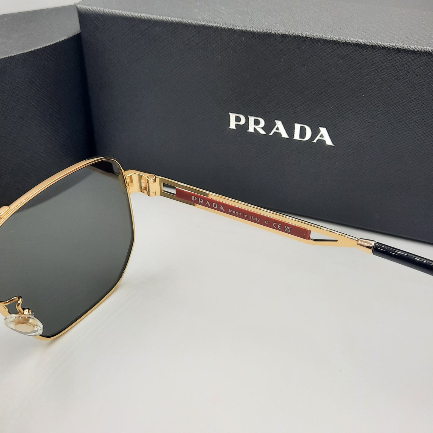 Solaires: PRADA OPS51ZS rouge doré noir