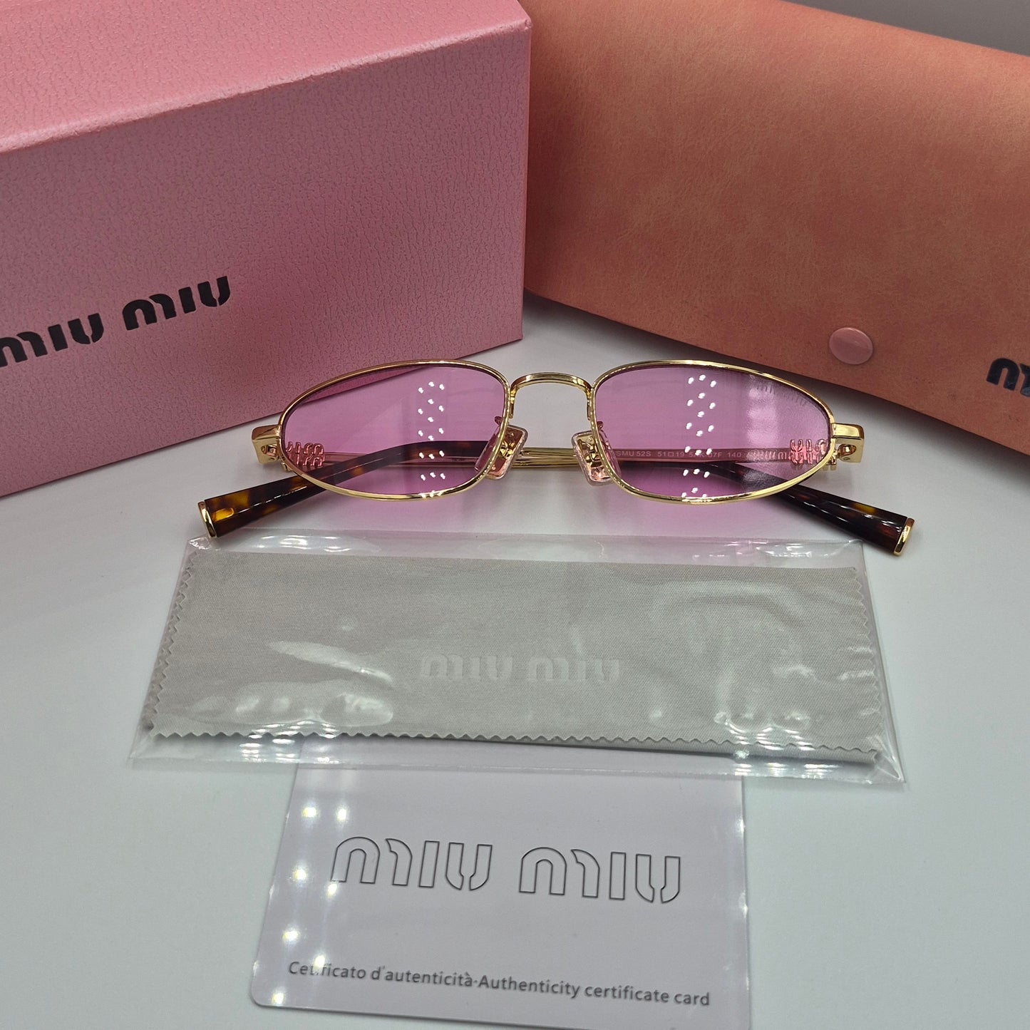 Solaires: MIUMIU SMU52S doré rose