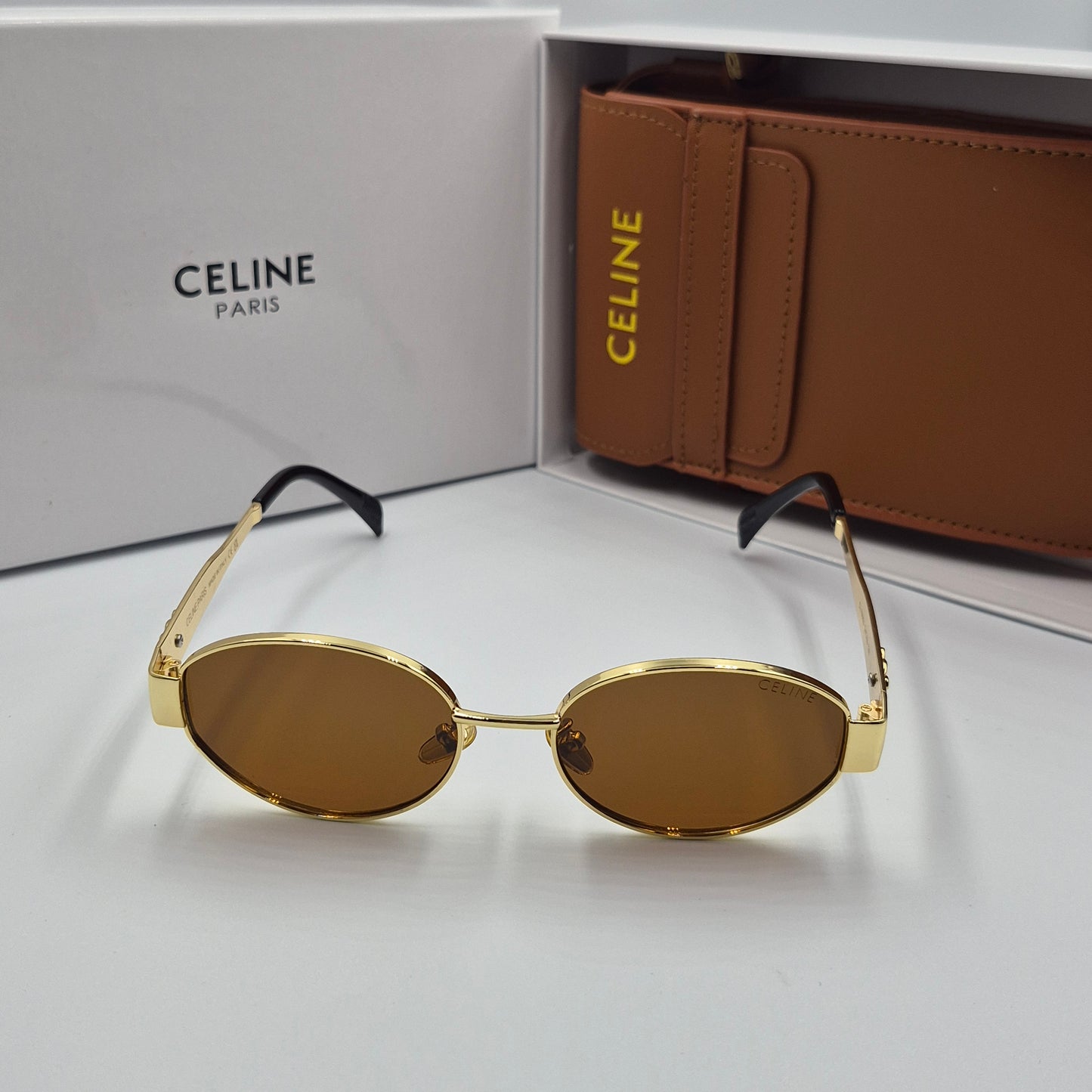 Solaires: CELINE Triomphe doré marron avec pochette à bandoulière