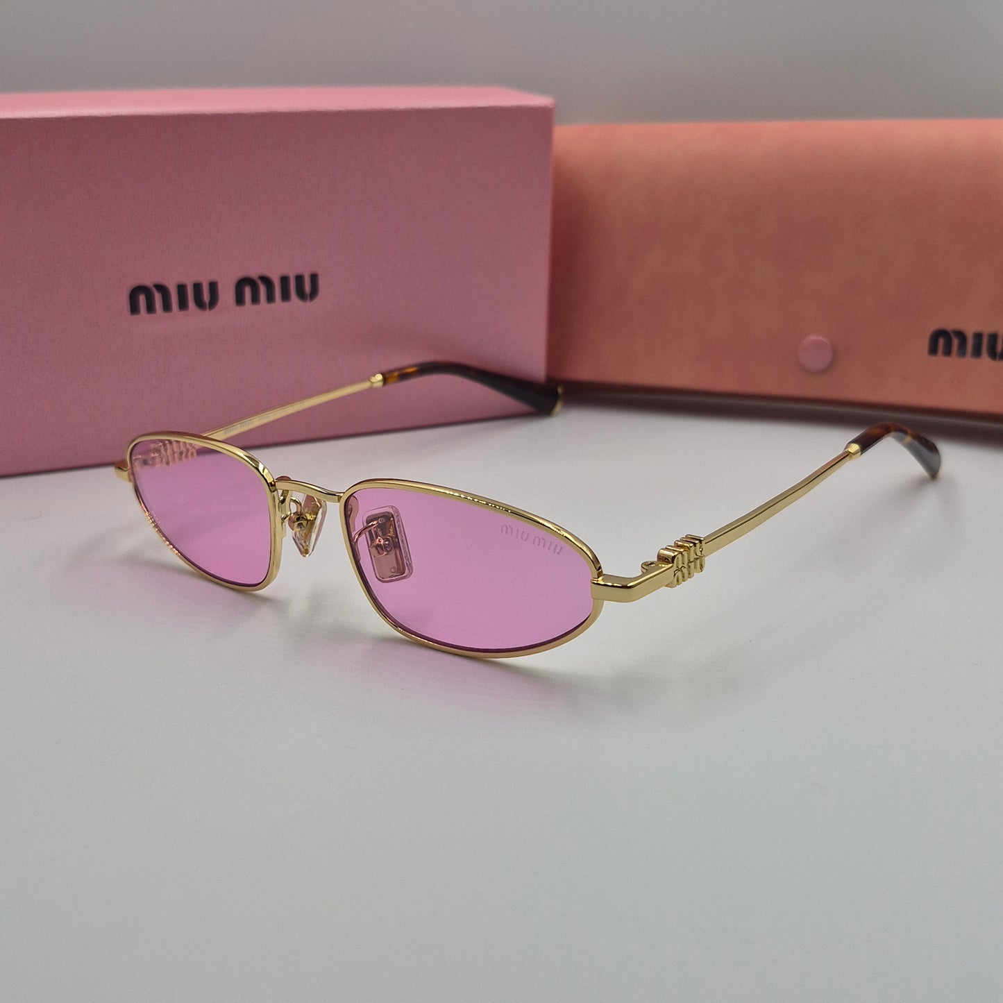 Solaires: MIUMIU SMU52S doré rose