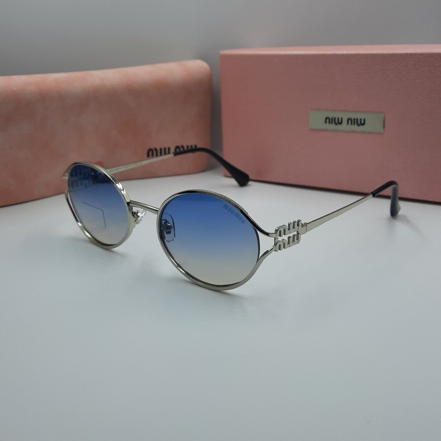 Solaires: MIUMIU argenté bleu