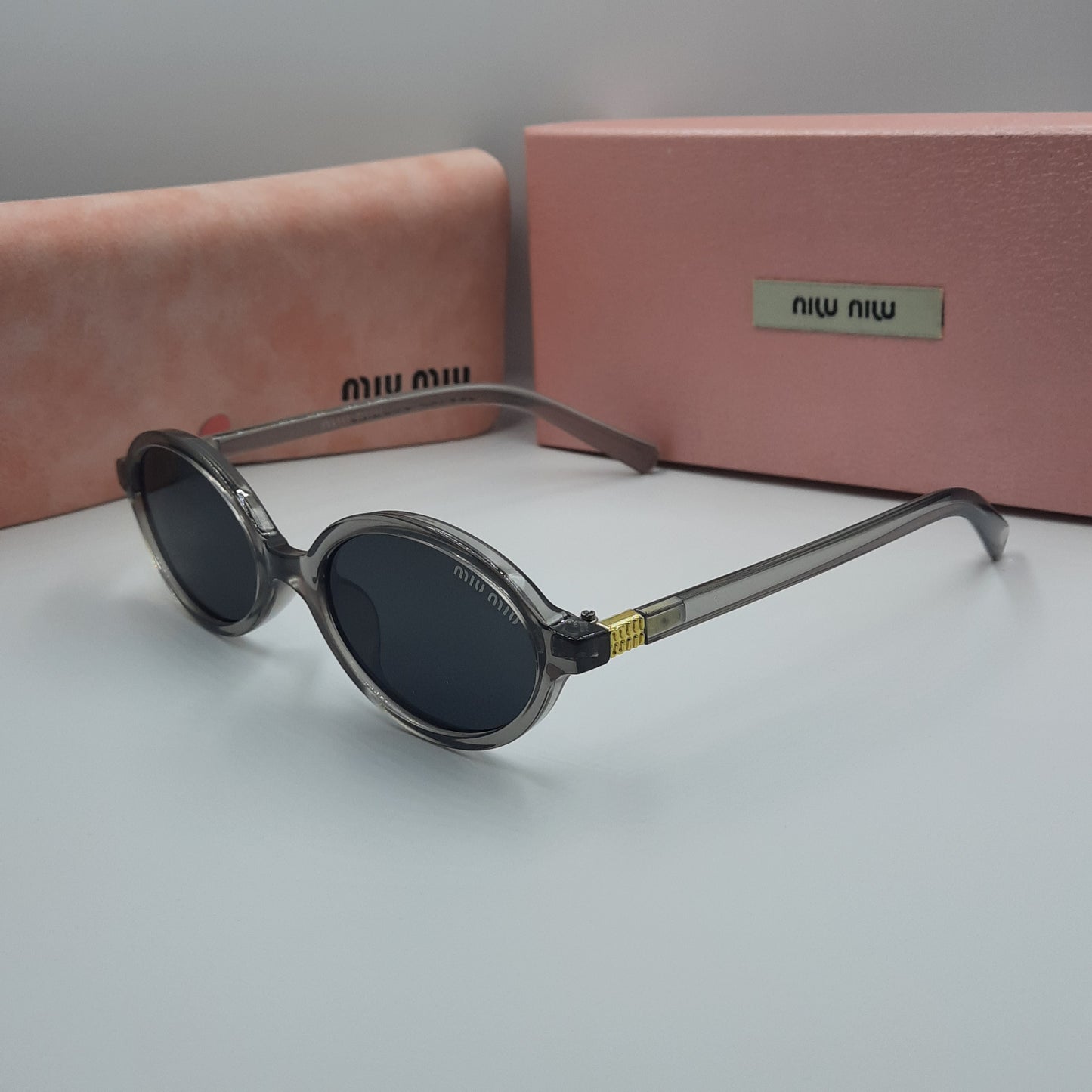 Solaires: MIUMIU doré gris
