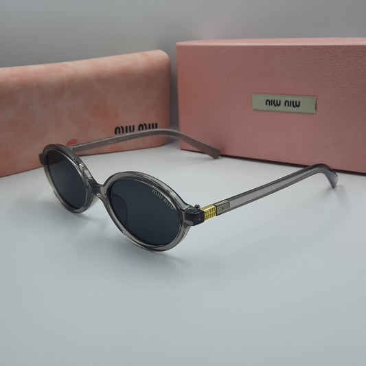 Solaires: MIUMIU doré gris