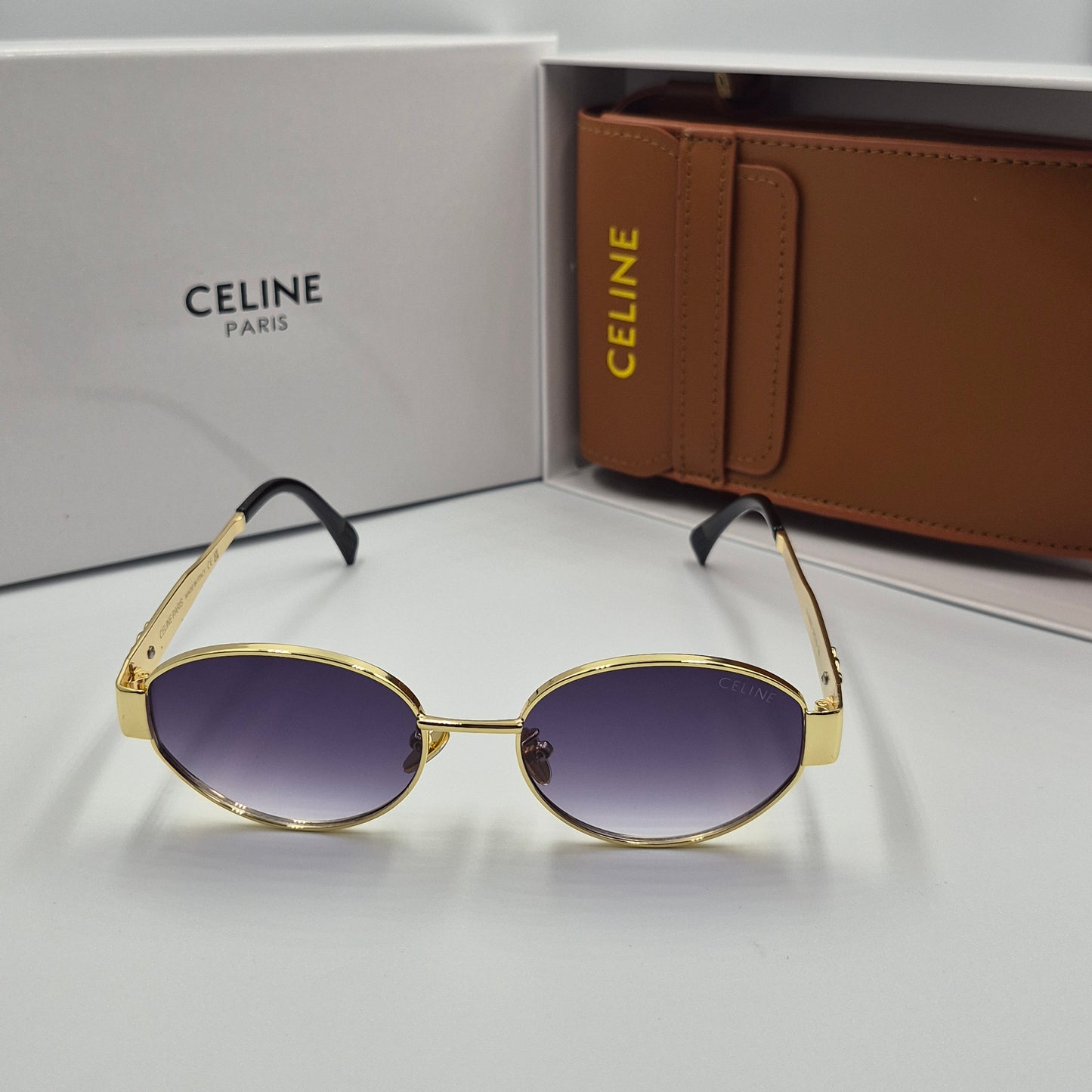 Solaires: CELINE Triomphe doré noir deg avec pochette à bandoulière