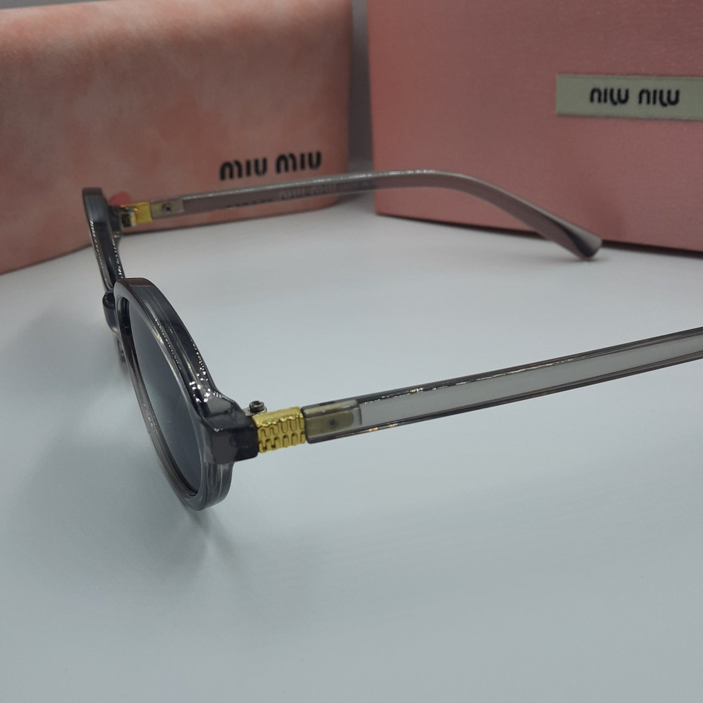 Solaires: MIUMIU doré gris